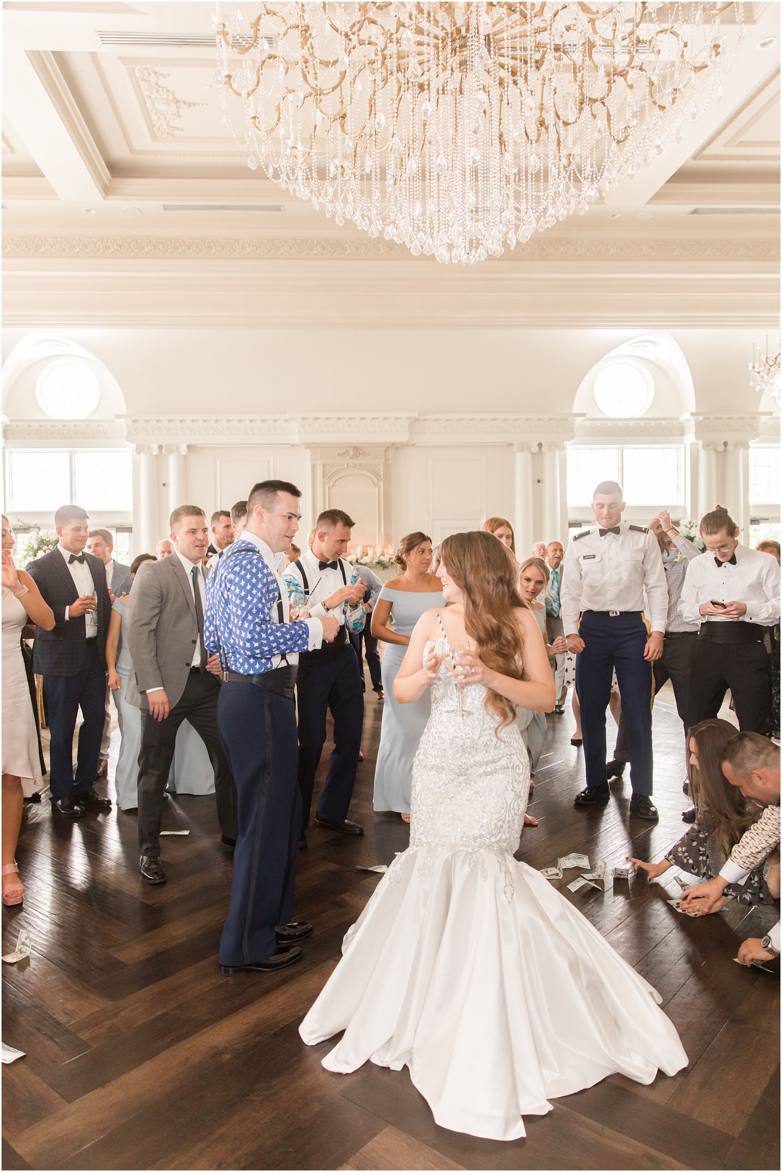 newlyweds dance with guests during East Brunswick NJ wedding reception