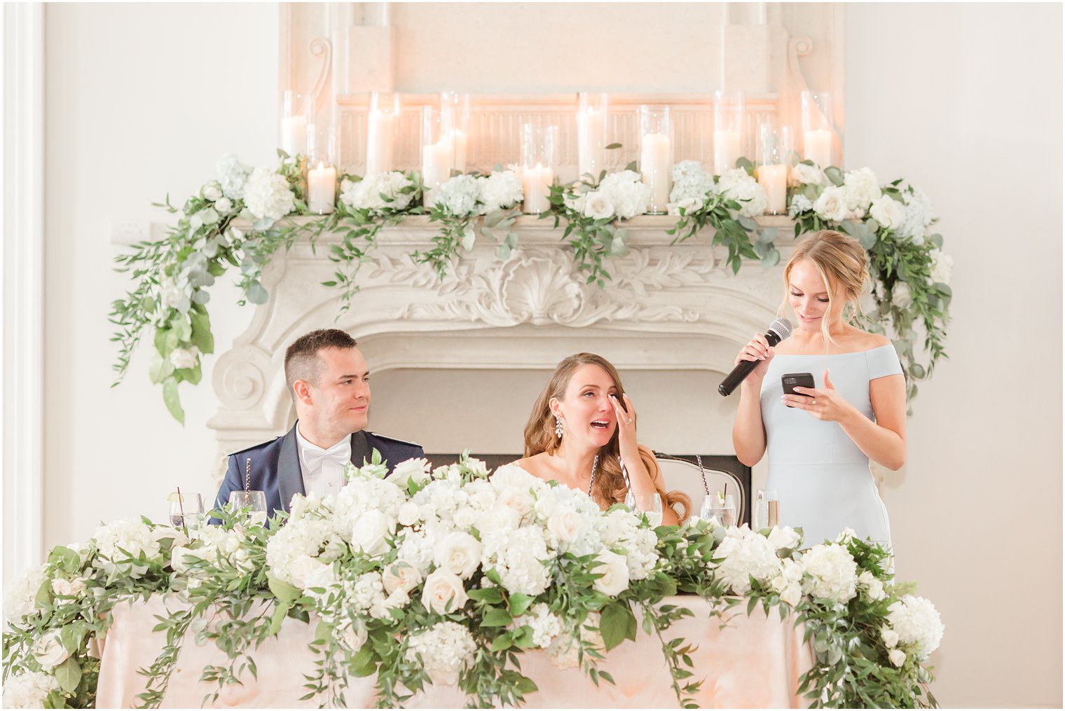 bride cries during toast from maid of honor at East Brunswick NJ wedding reception