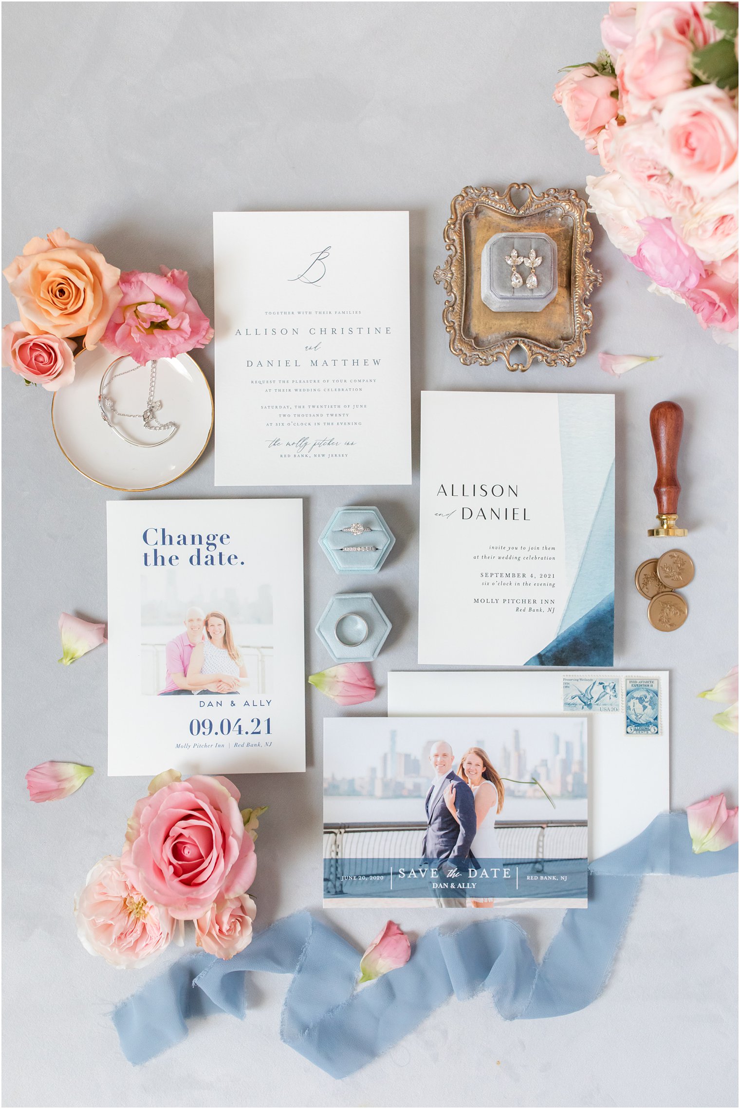 flat lay with wedding invitation suite and pink flowers 
