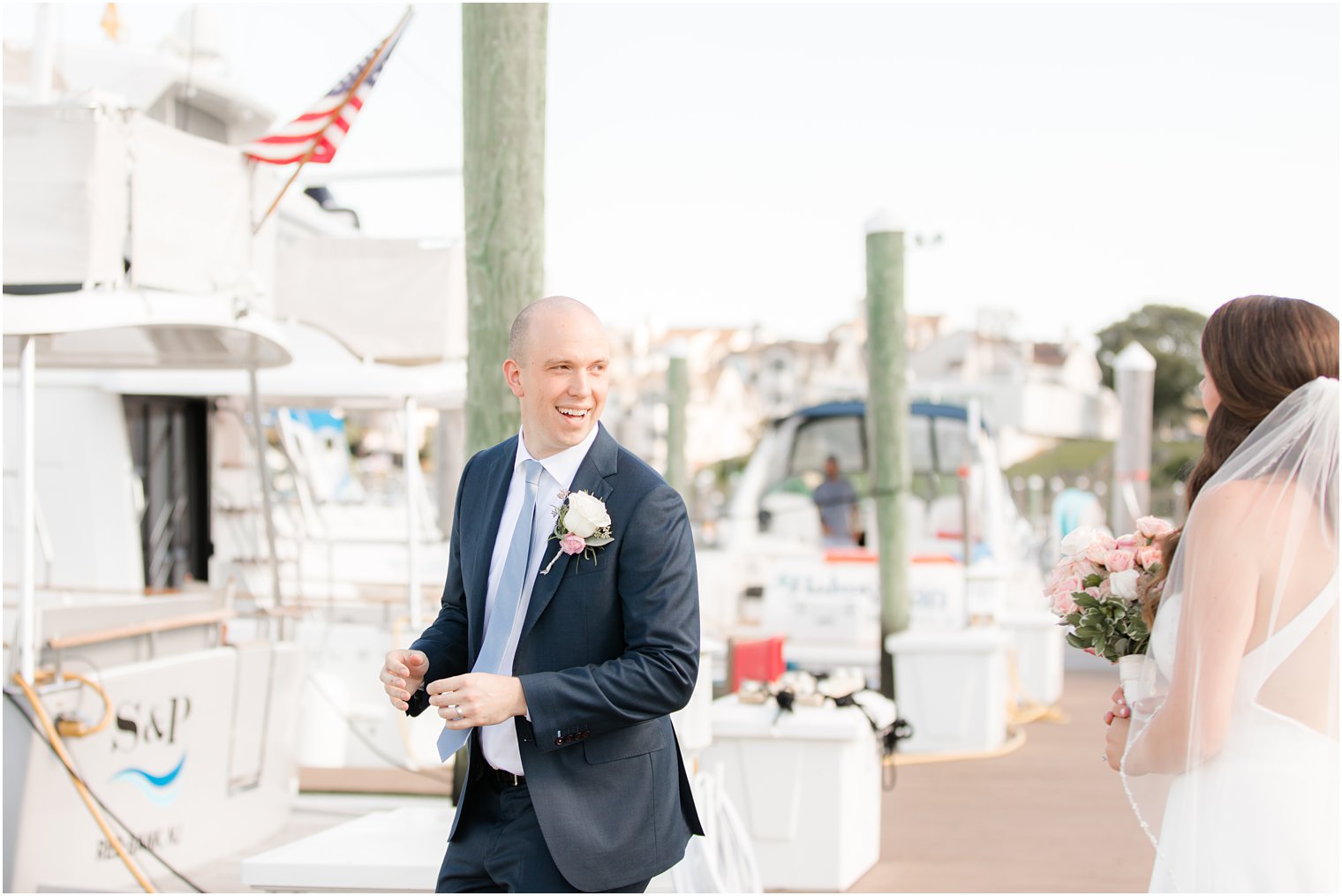 groom turns to look at bride during first look 