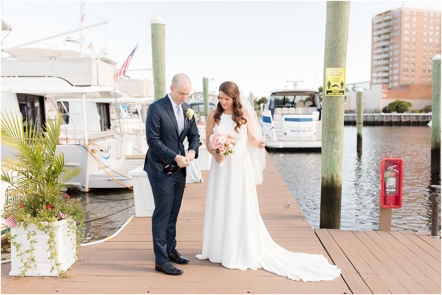 groom prepares for champagne toast on wedding day