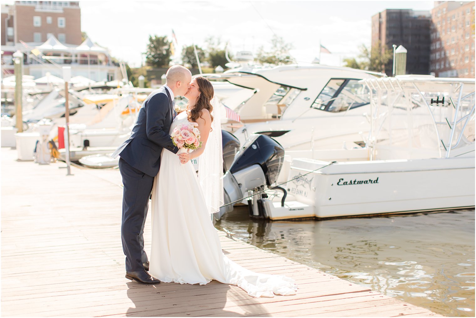 couple kisses on marina in Red Bank NJ