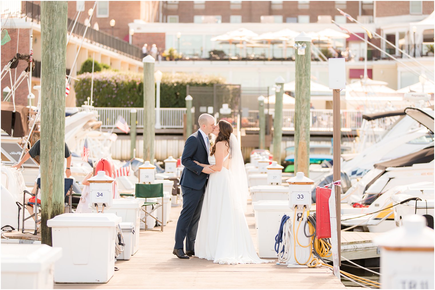 bride and groom kiss on Red Bank NJ marina 