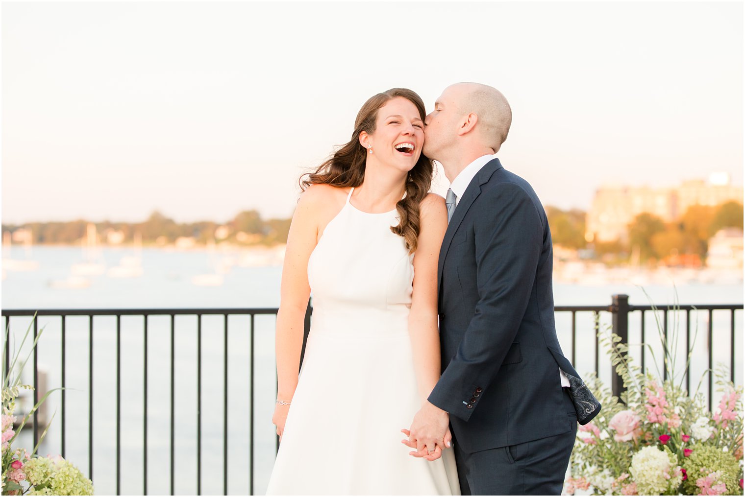 groom kisses bride's cheek during wedding photos in Red Bank NJ