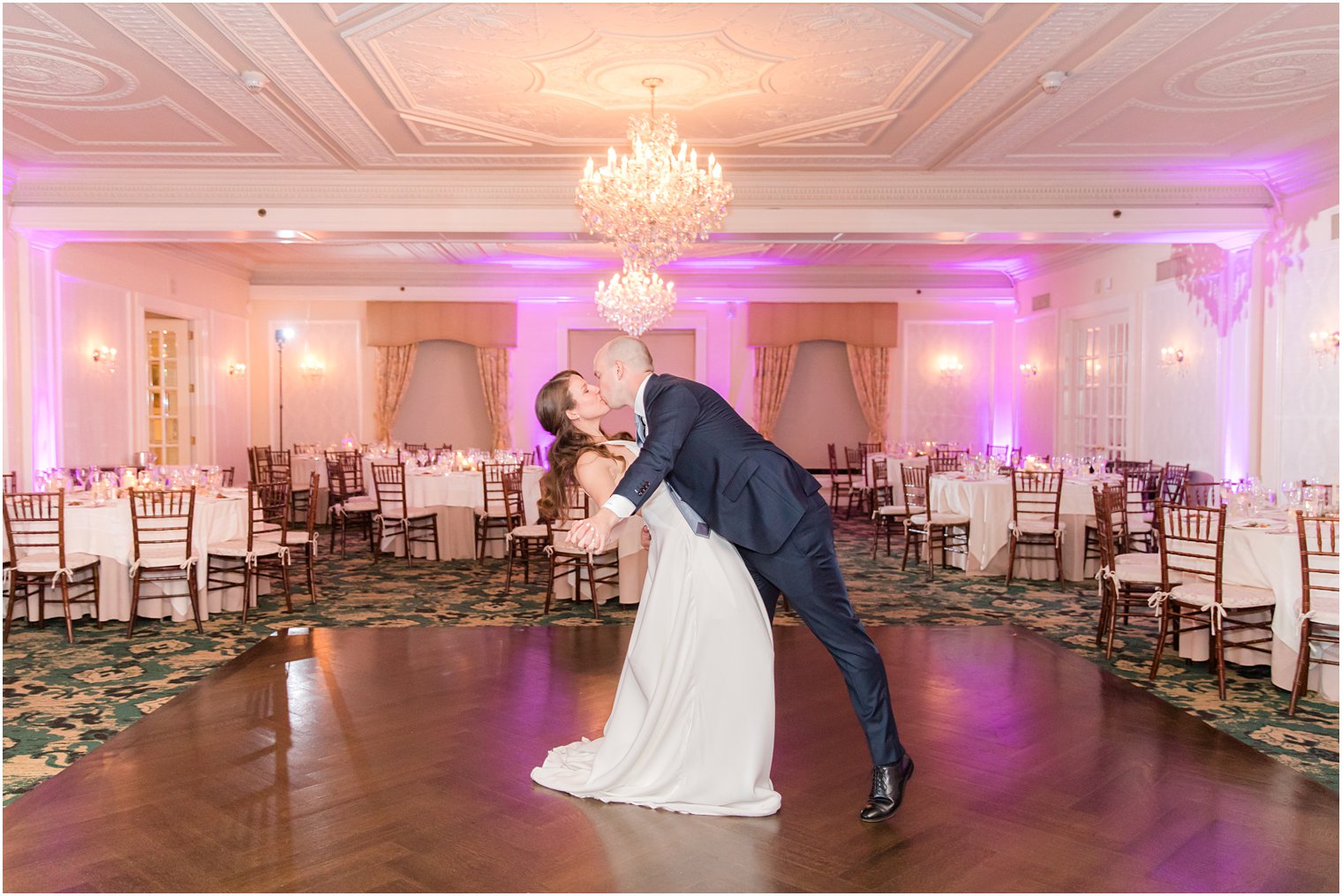 groom kisses bride on dance floor at Molly Pitcher Inn