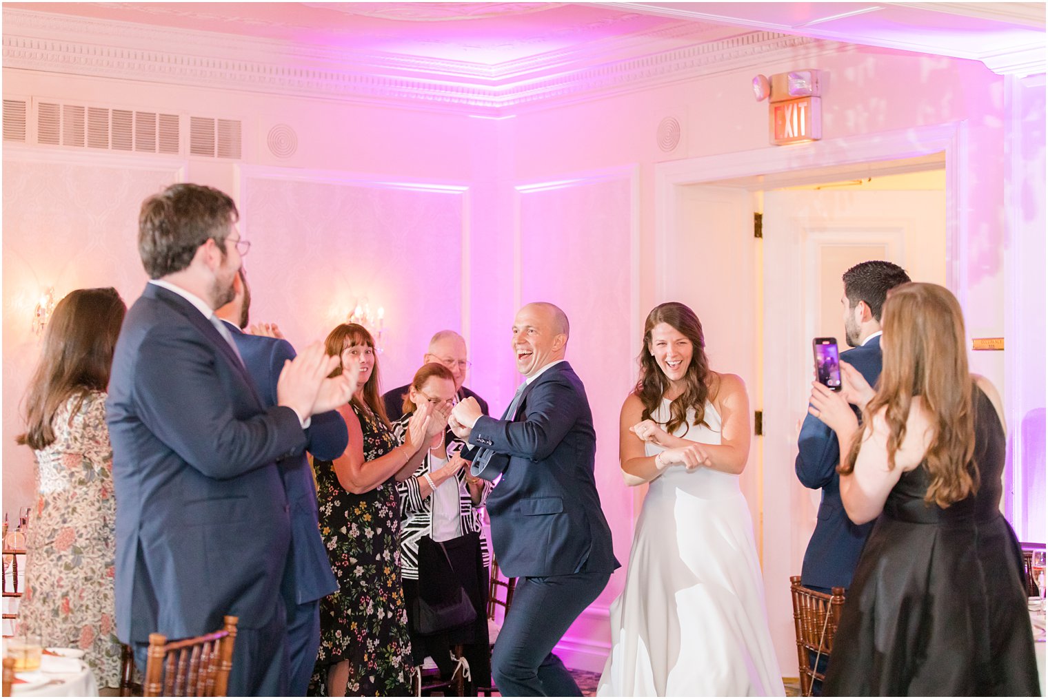 bride and groom enter wedding reception