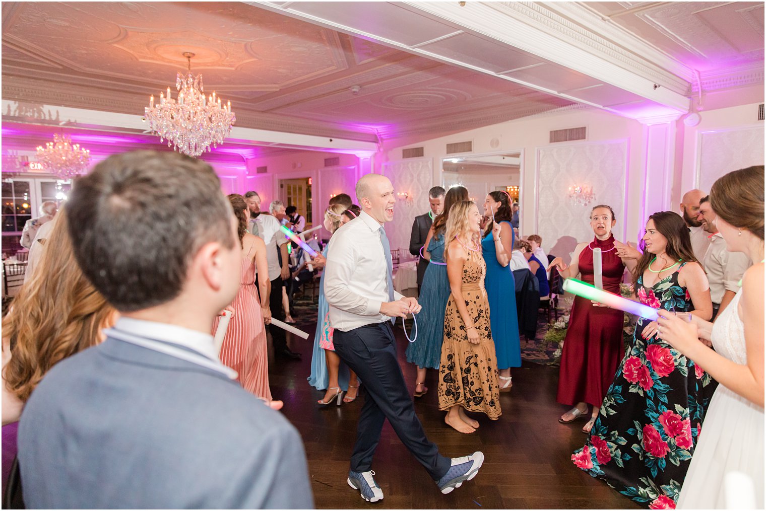 groom dances with guests during NJ wedding reception 