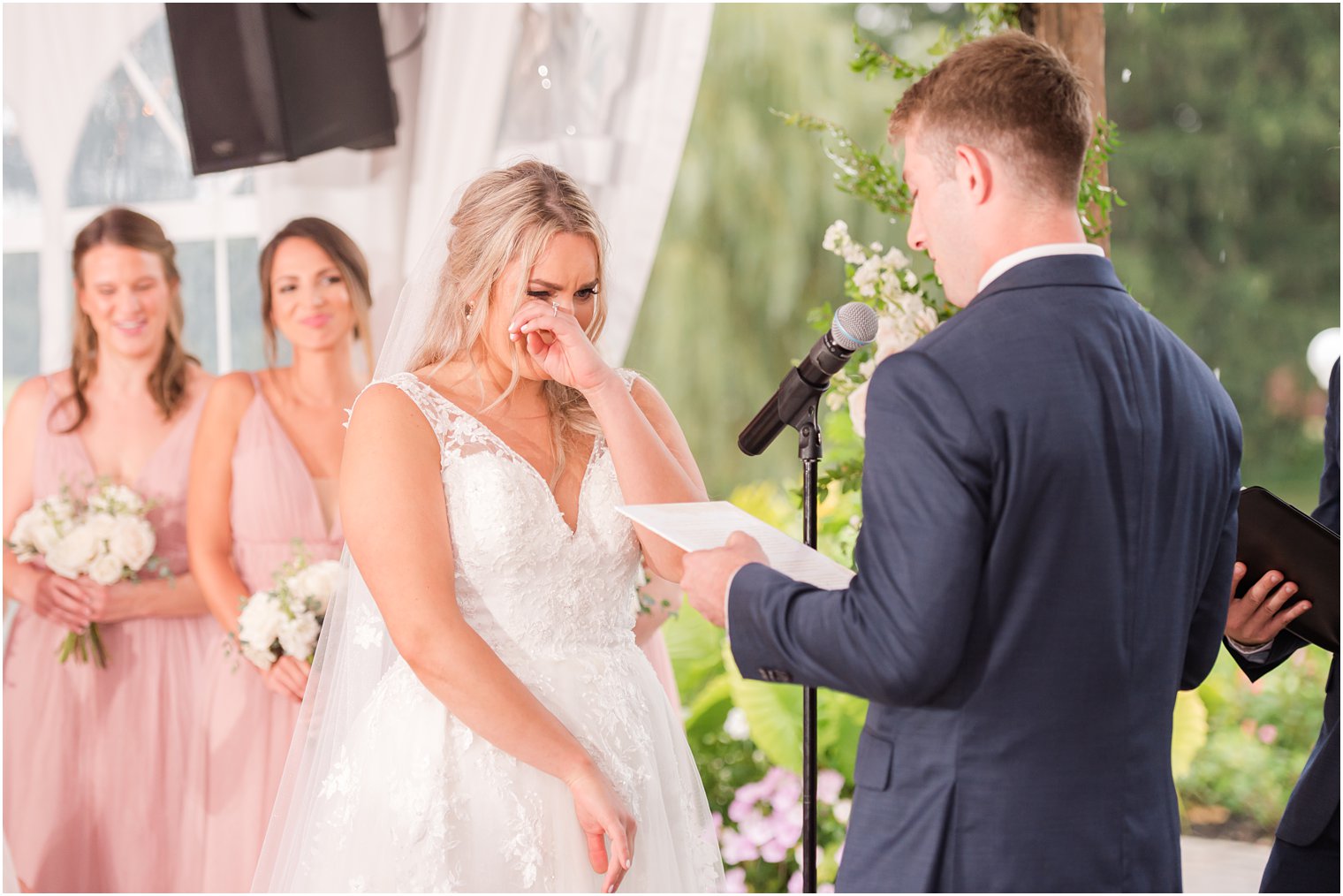 groom reads vows to bride during NJ wedding ceremony 