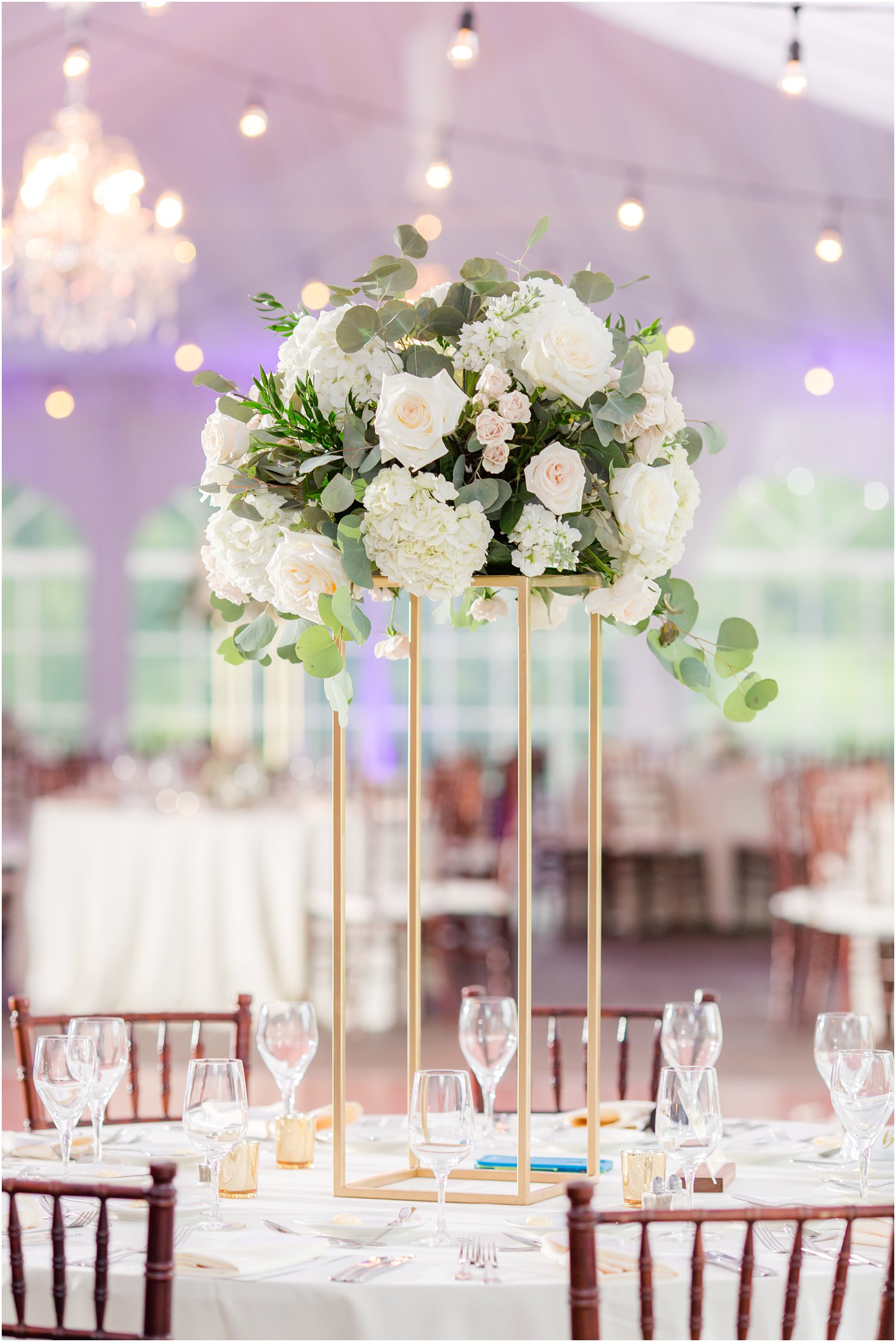 tall wedding centerpiece with white and pink flowers