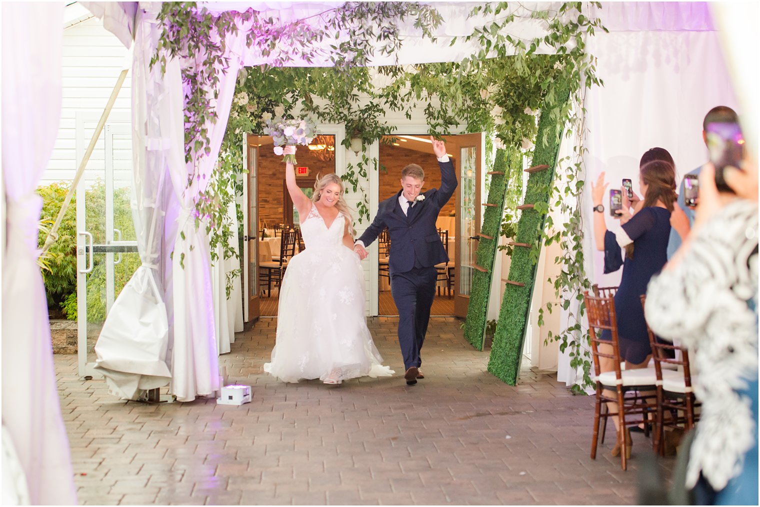 bride and groom cheer entering New Jersey wedding reception 