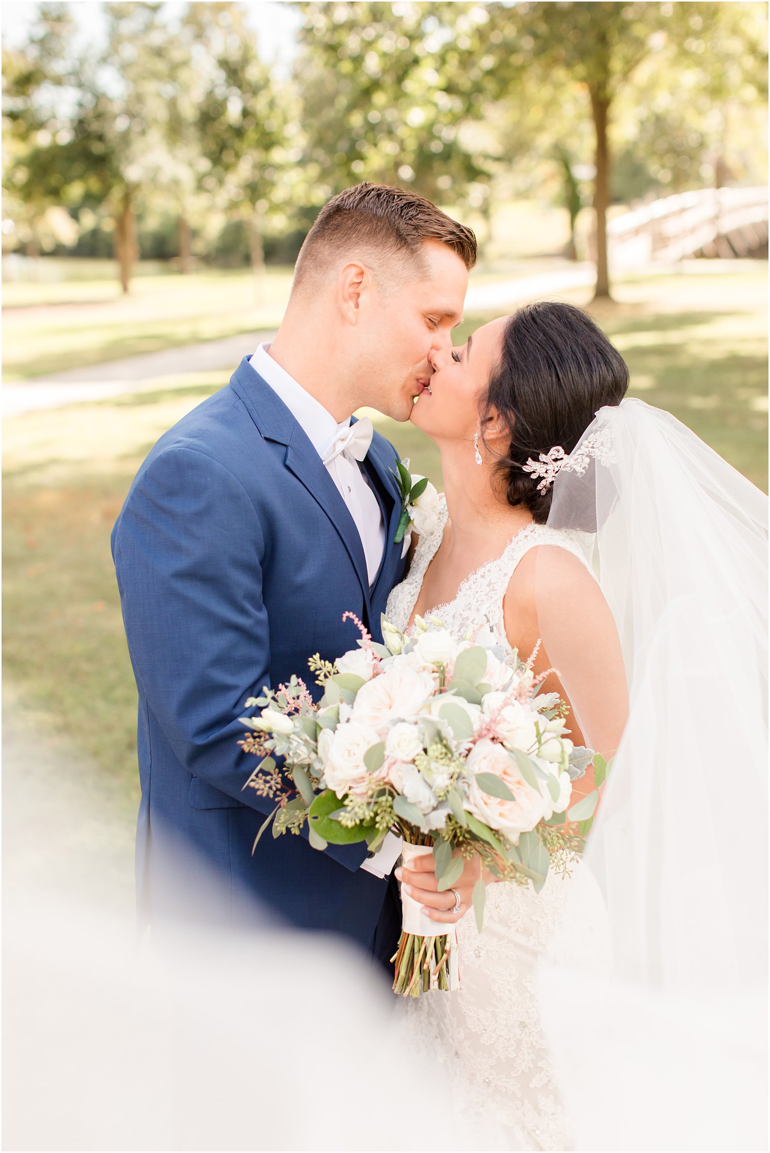 bride and groom kiss on NJ wedding day