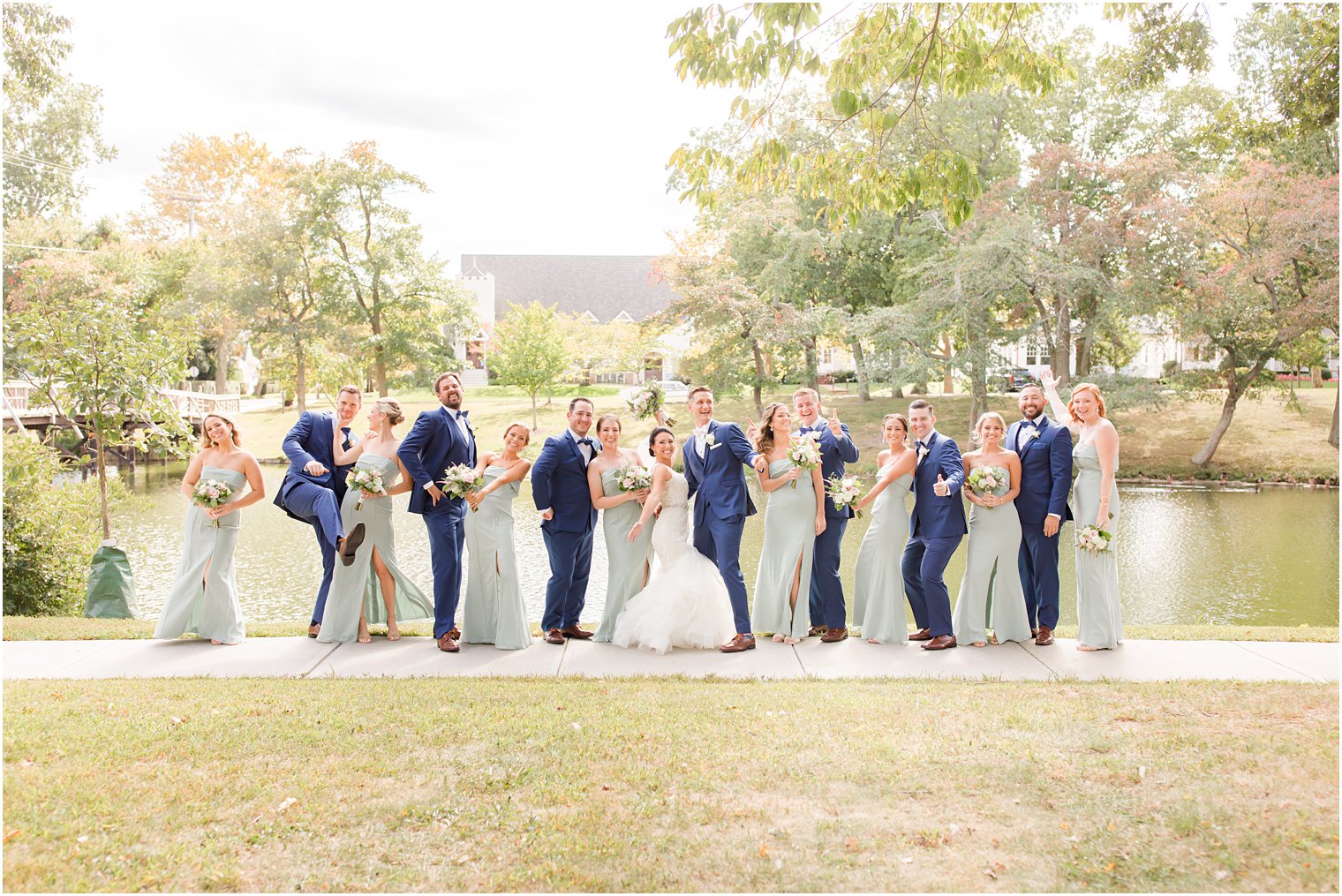 newlyweds dance with wedding party in New Jersey park