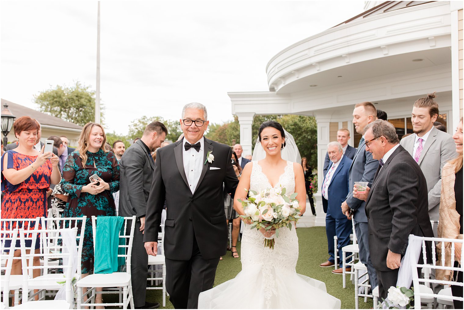 bride and dwalk up aisle during Clarks Landing ceremony