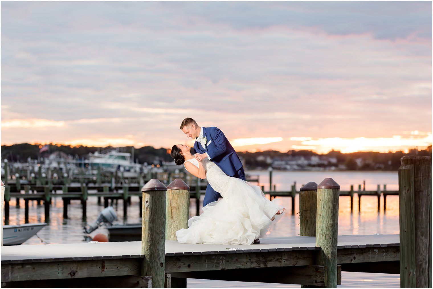 newlyweds dip on dock at Clarks Landing