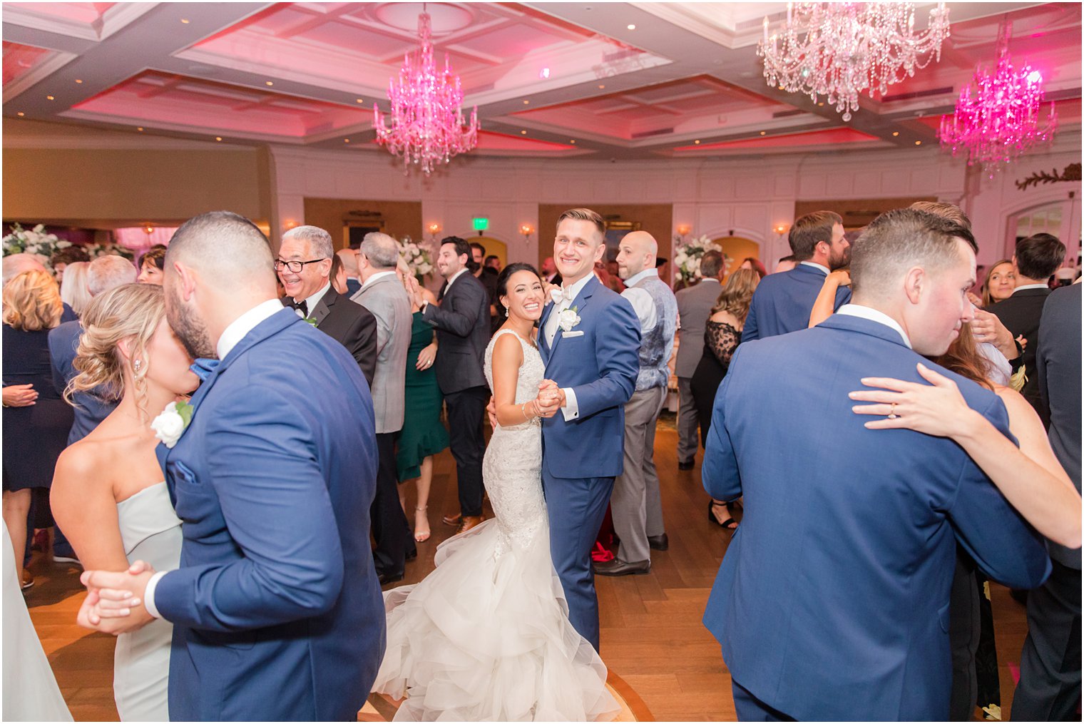 newlyweds dance with wedding guests during Delran NJ wedding reception