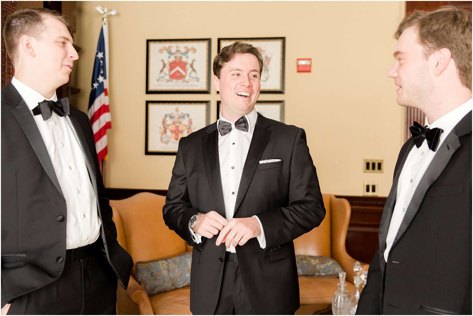 groom laughs with groomsmen before Eagle Oaks wedding