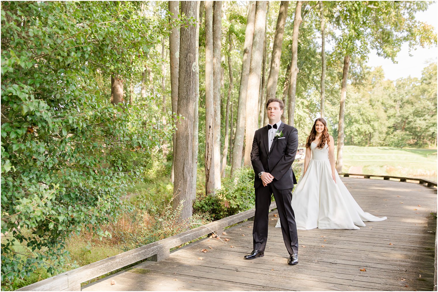 bride walks up to groom during first look at Eagle Oaks