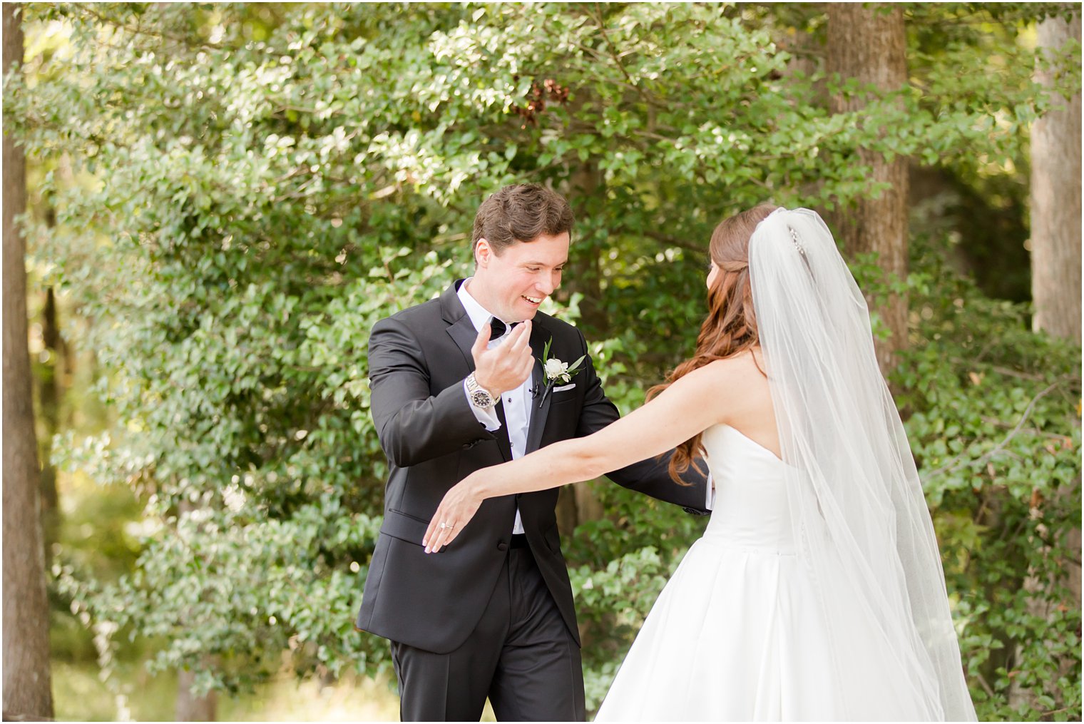 groo smiles during first look with bride at Eagle Oaks