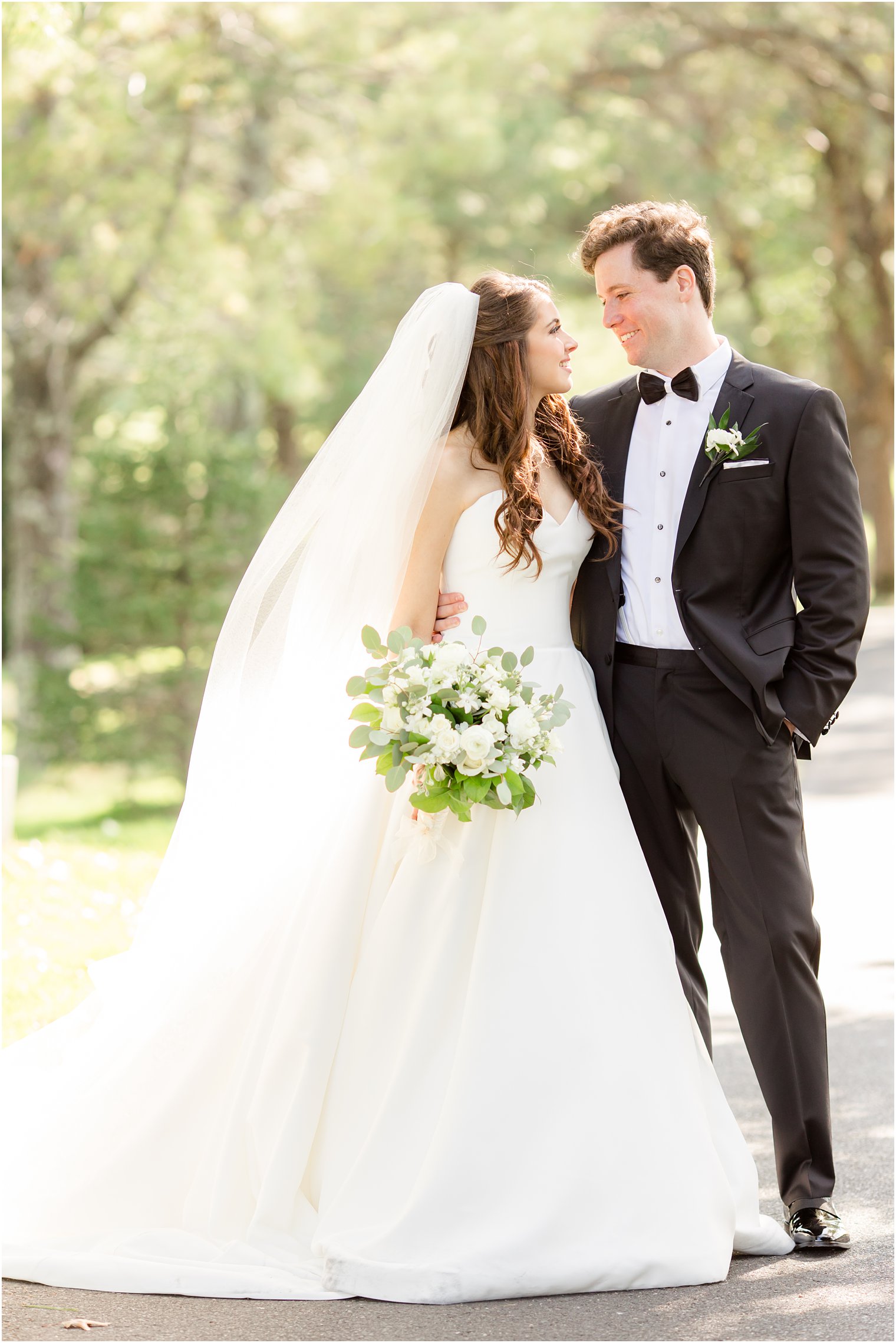 bride and groom hug at Eagle Oaks Golf and Country Club