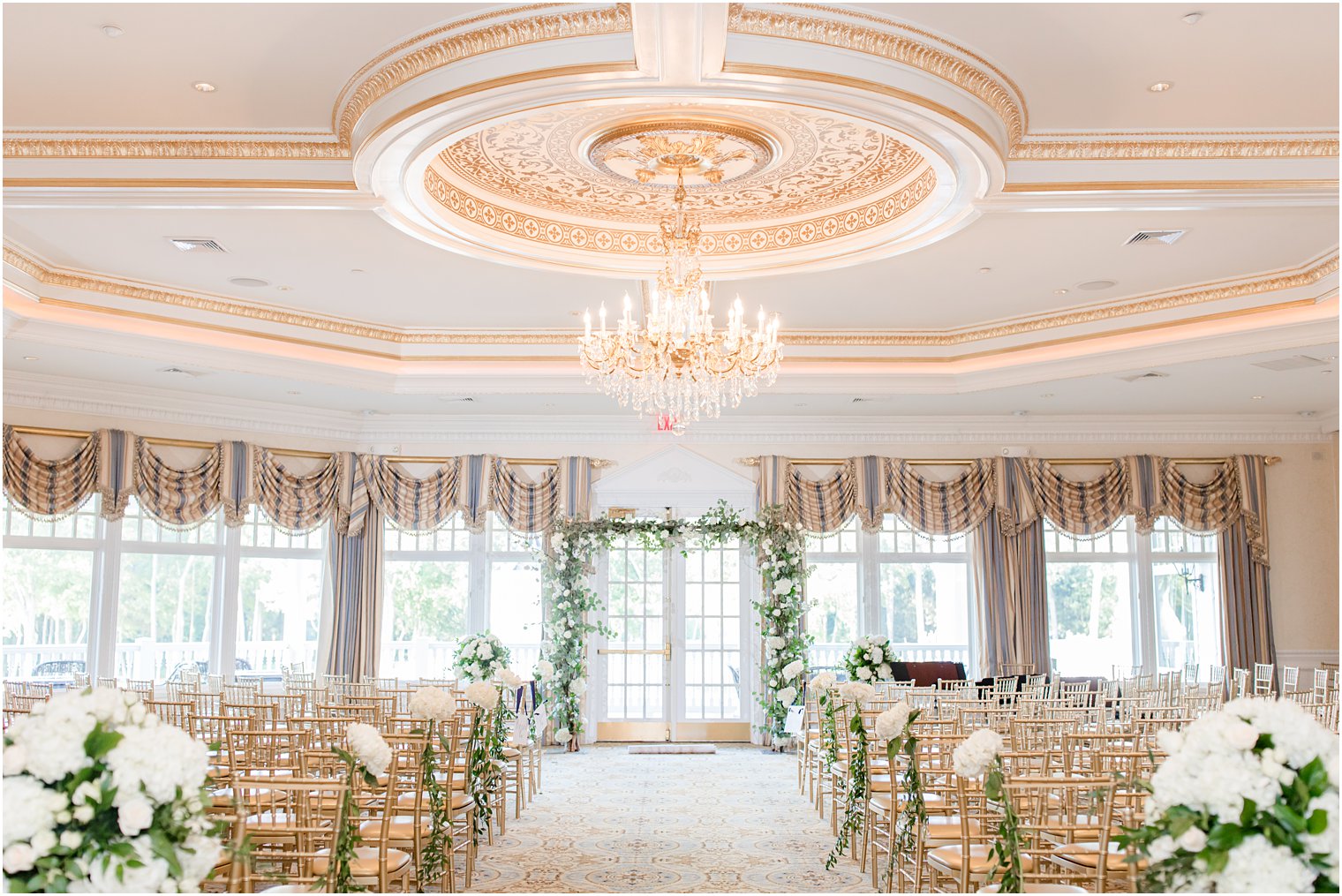 Eagle Oaks Golf and Country Club wedding ceremony with white floral decor