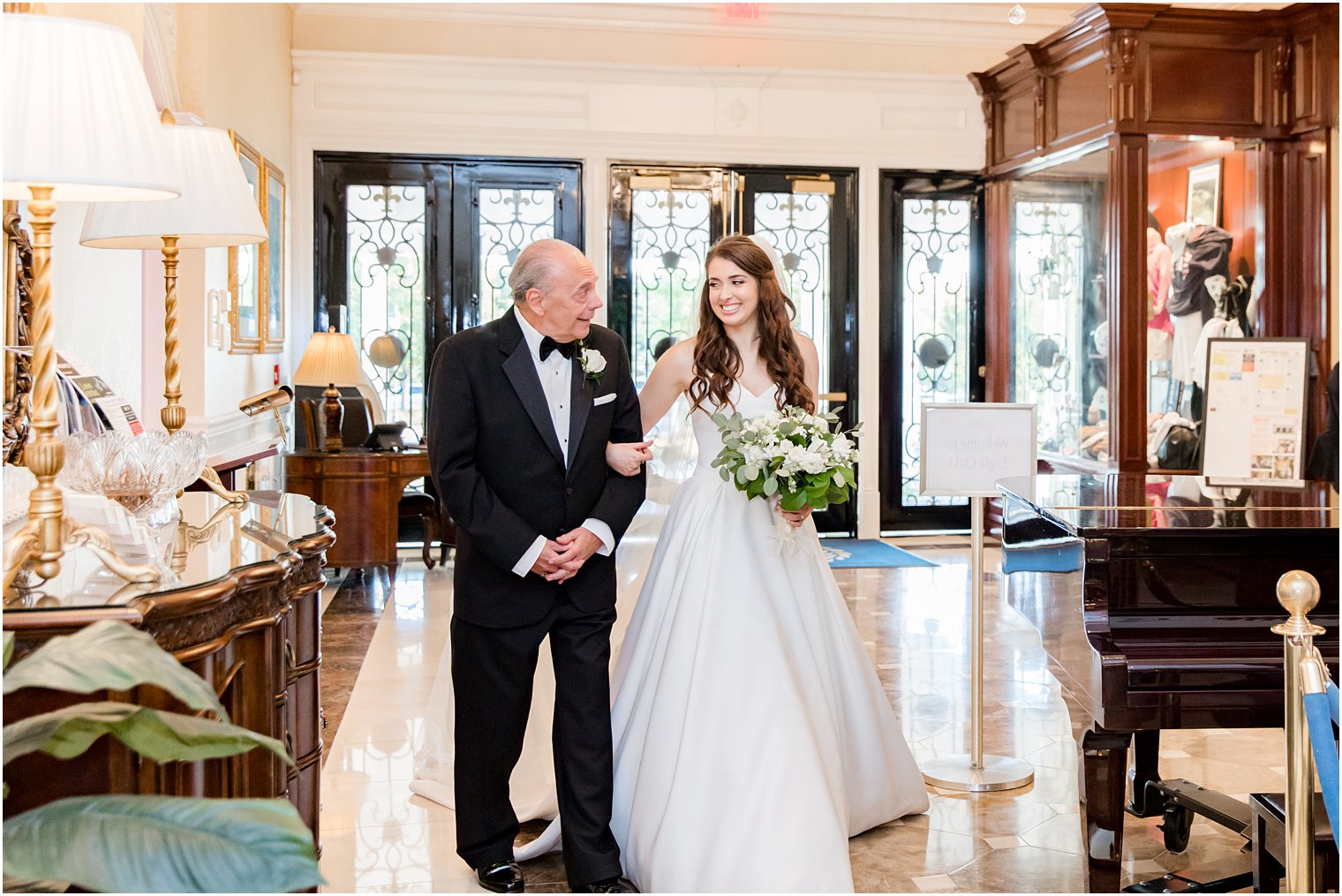 bride and dad wait to walk down aisle at Eagle Oaks Golf and Country Club