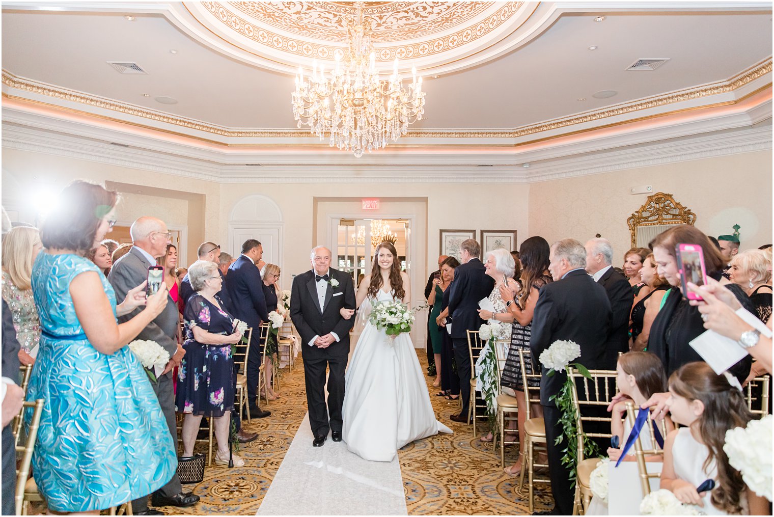 bride walks down aisle at Eagle Oaks Golf and Country Club