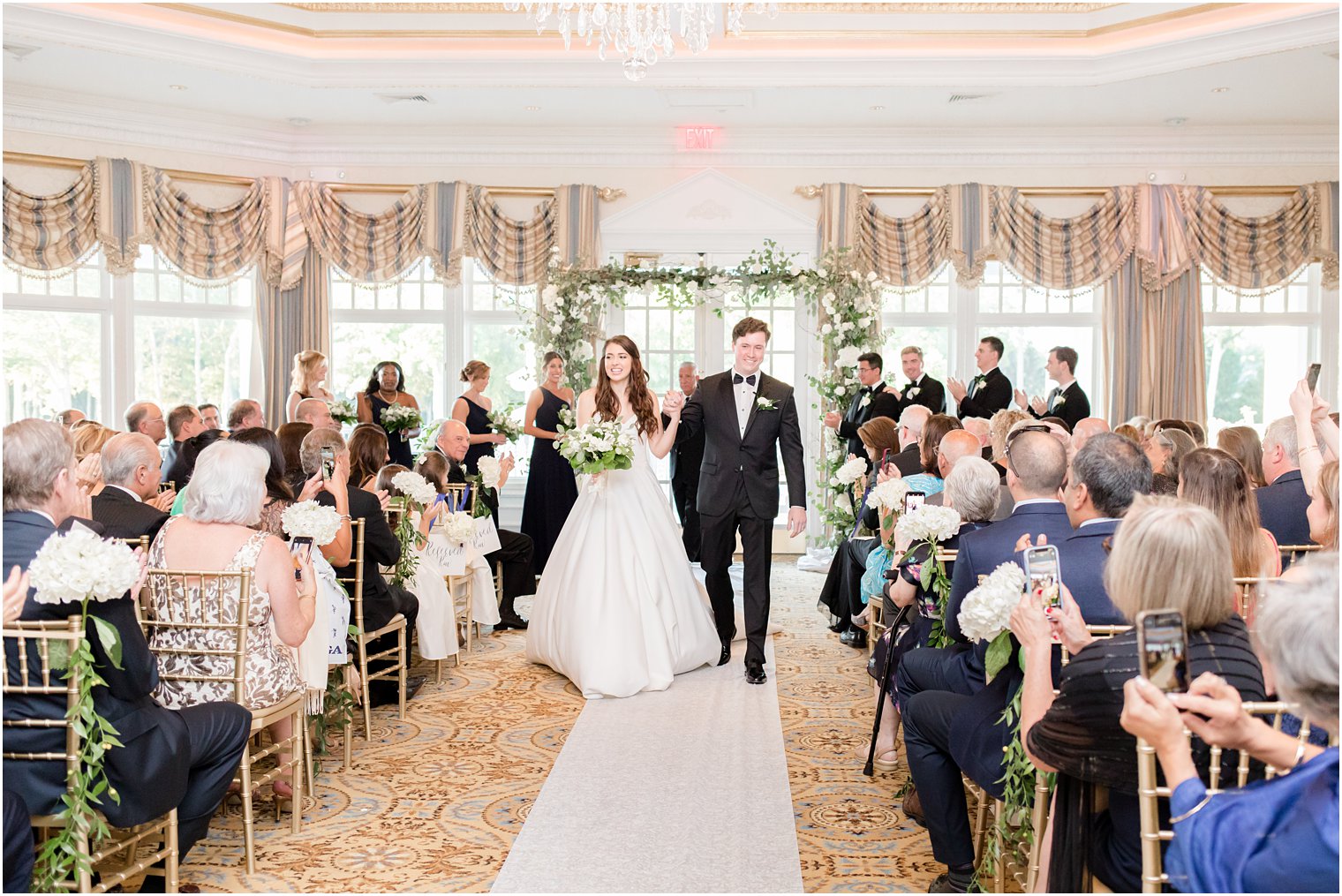bride and groom walk up aisle at Eagle Oaks Golf and Country Club
