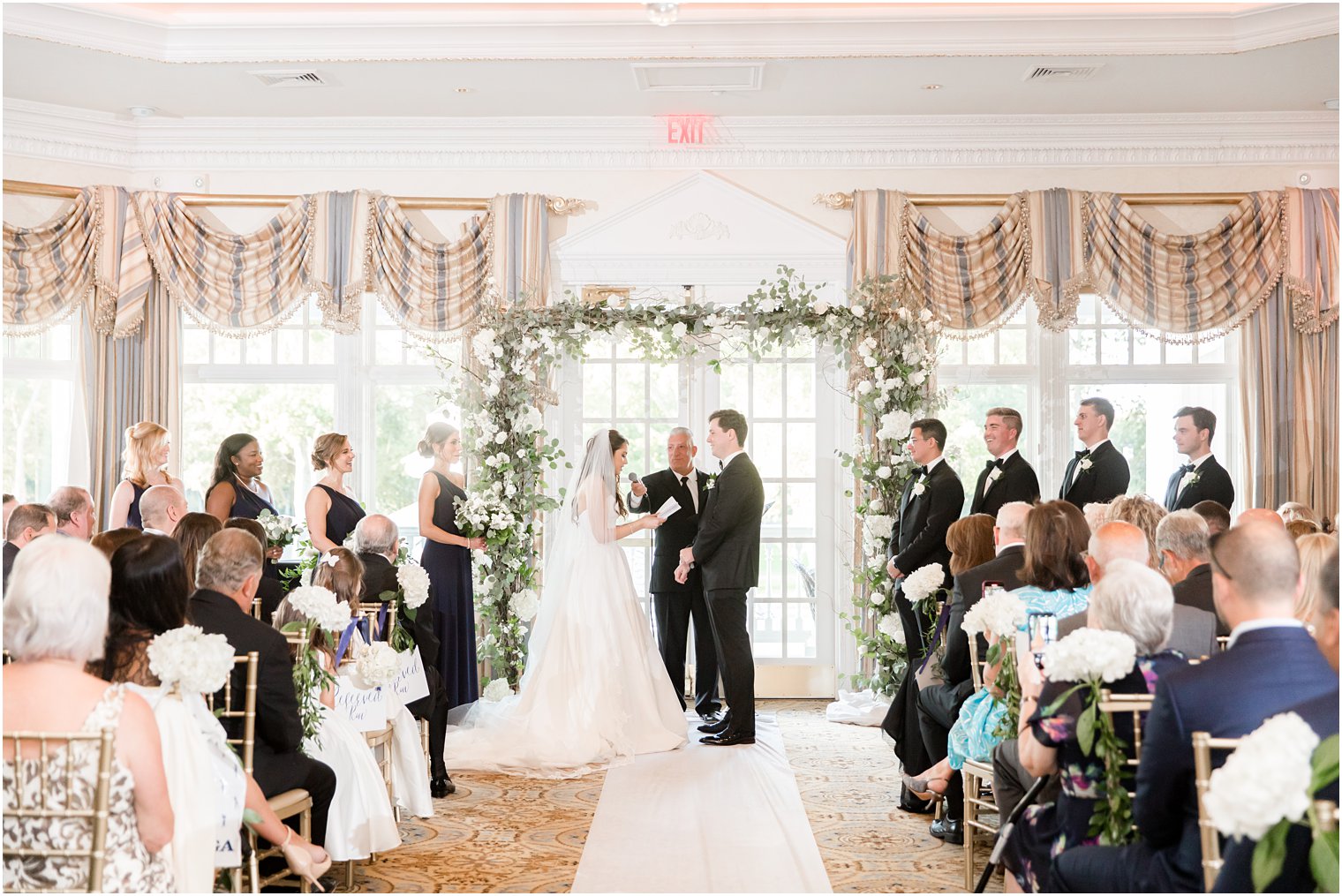 bride and groom exchange vows during ceremony at Eagle Oaks Golf and Country Club