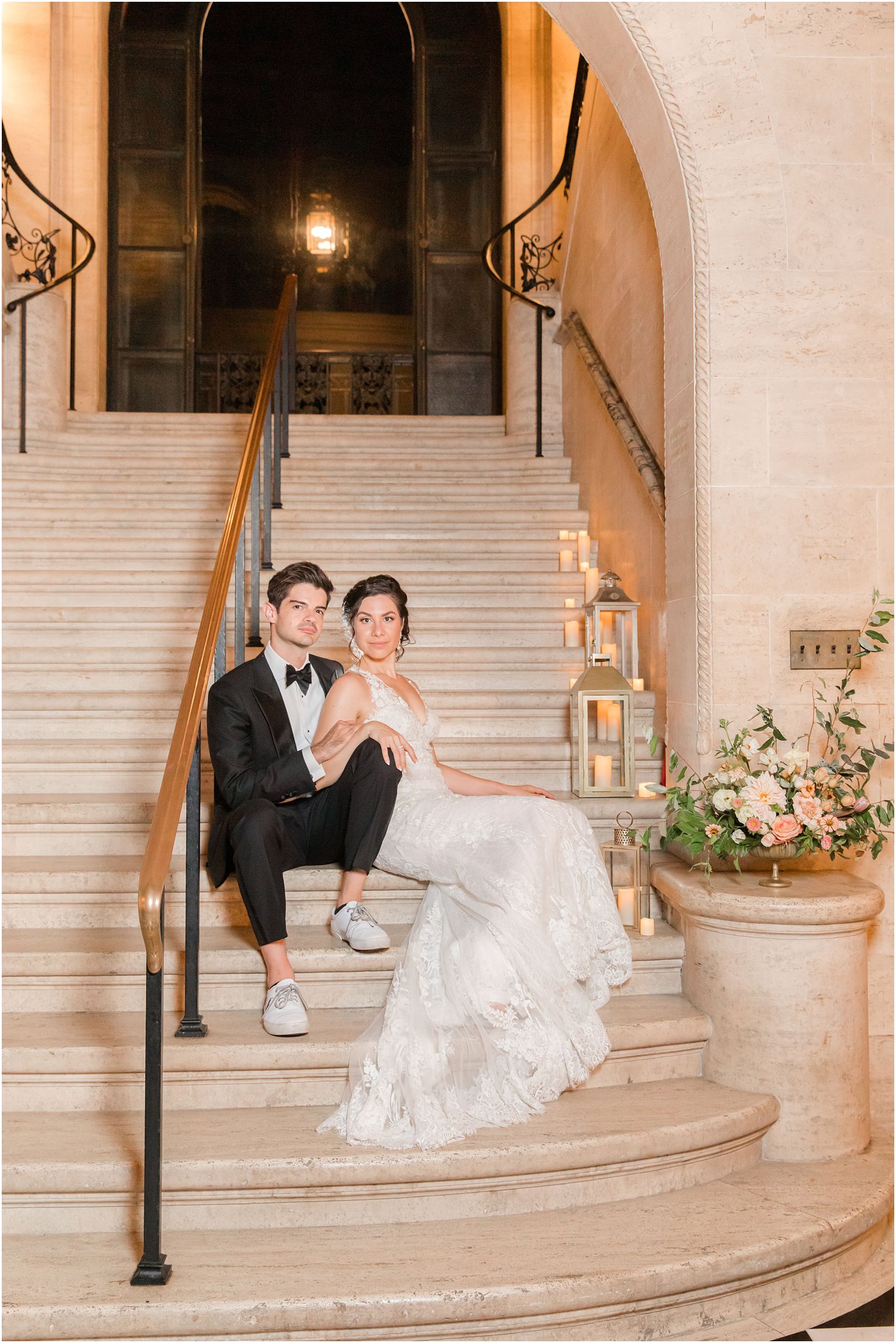 couple sitting on staircase at The Village Club of Sands Point