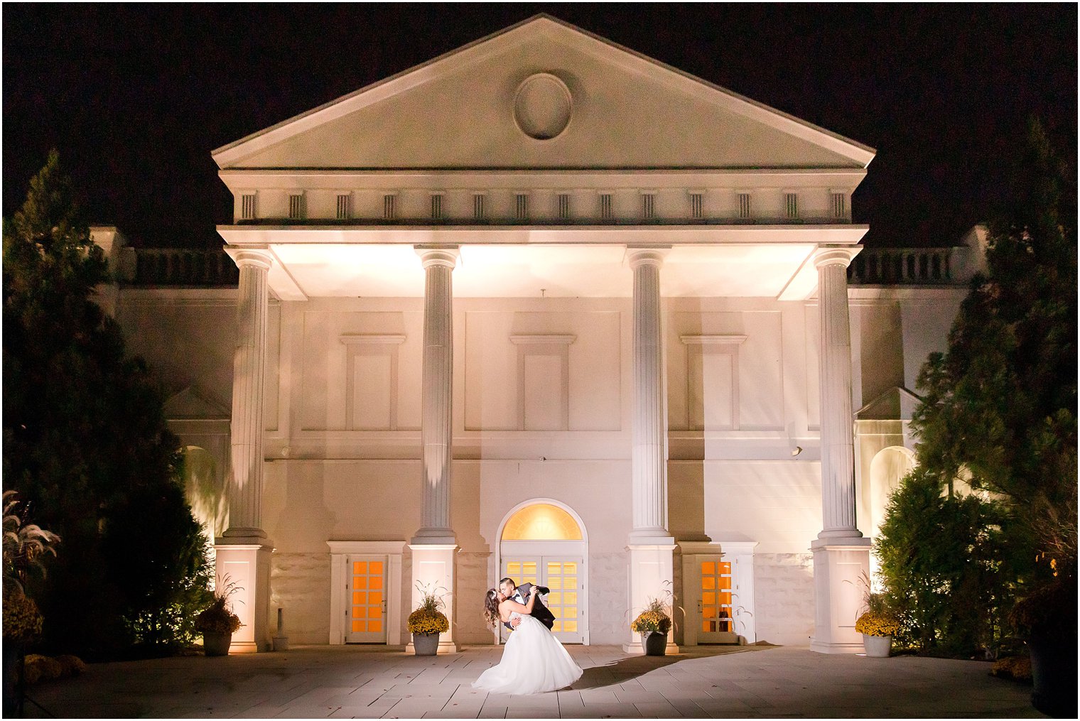 bride and groom in front of The Palace at Somerset Park