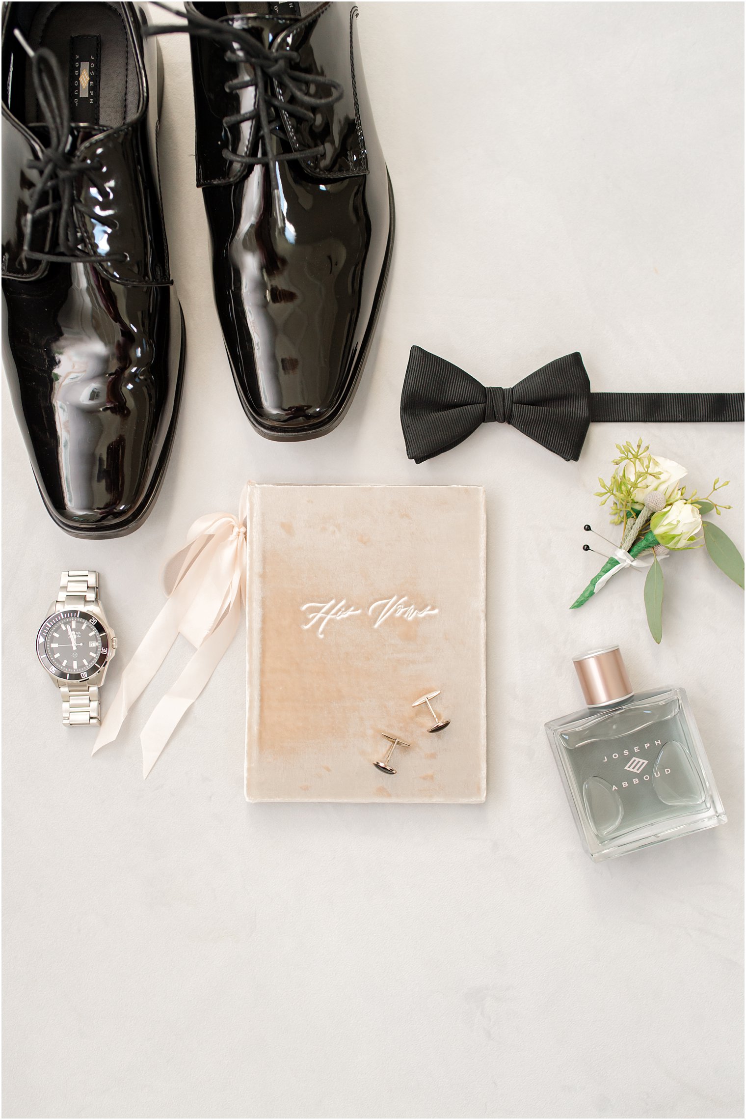 groom's vow book and shiny black shoes for NJ wedding