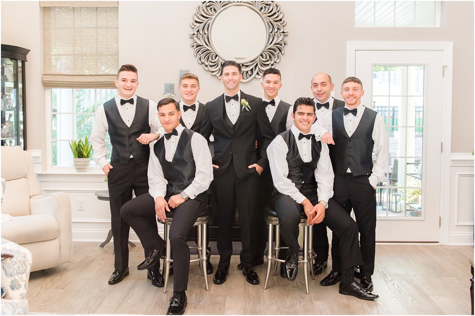 groom poses with groomsmen in Spring Lake NJ