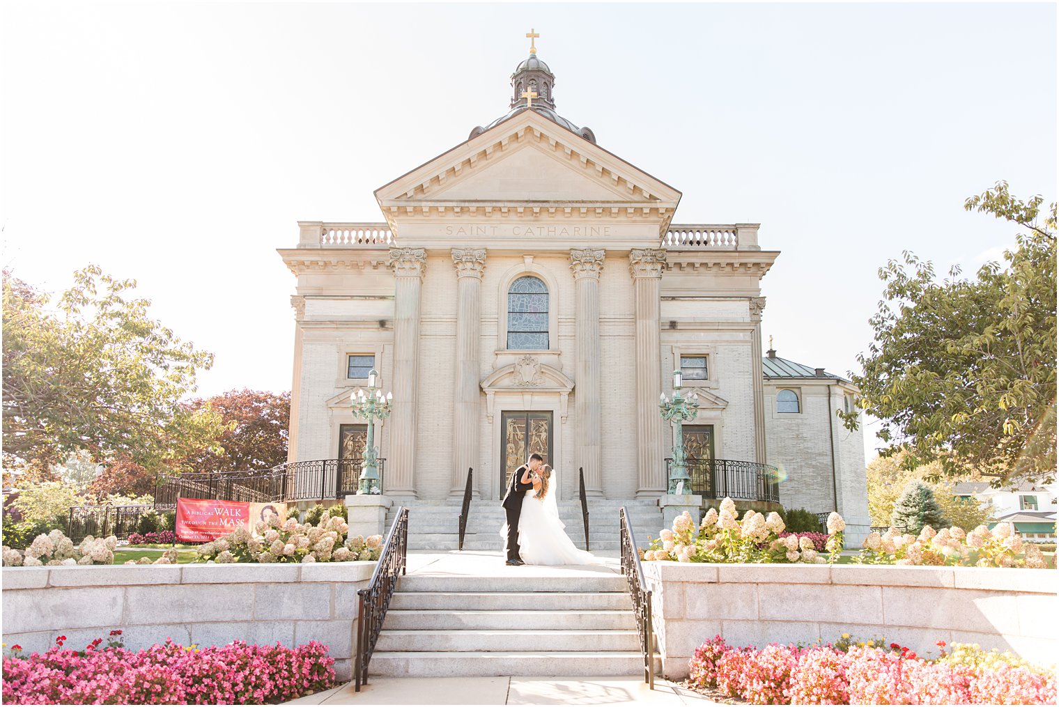 bride and groom pose outside Saint Catherine