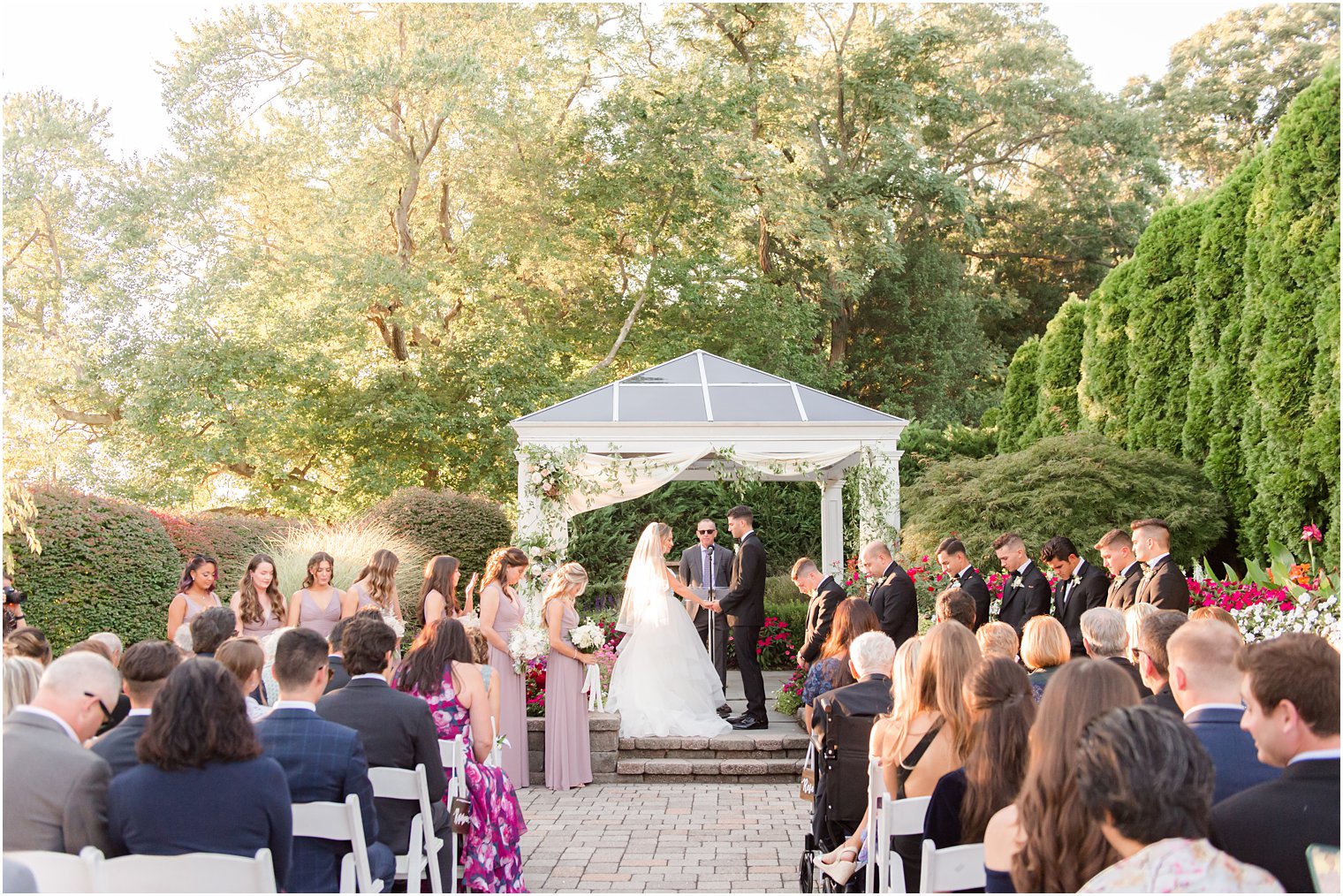 outdoor wedding ceremony in garden at the Mill Lakeside Manor