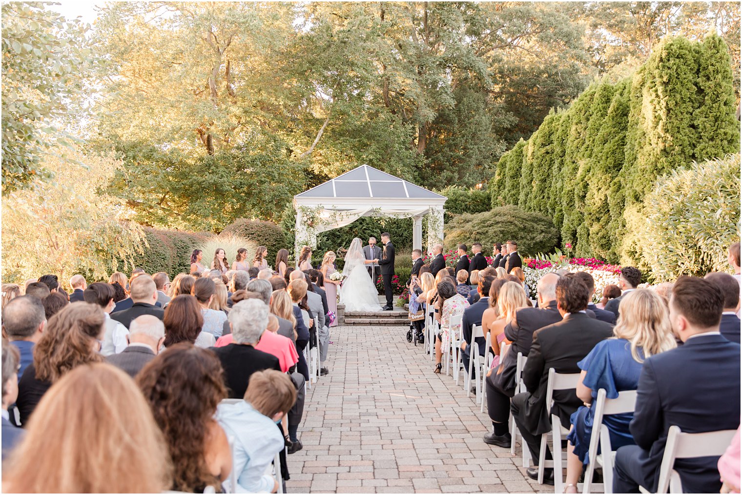 bride and groom hold hands during ceremony in Spring Lake NJ