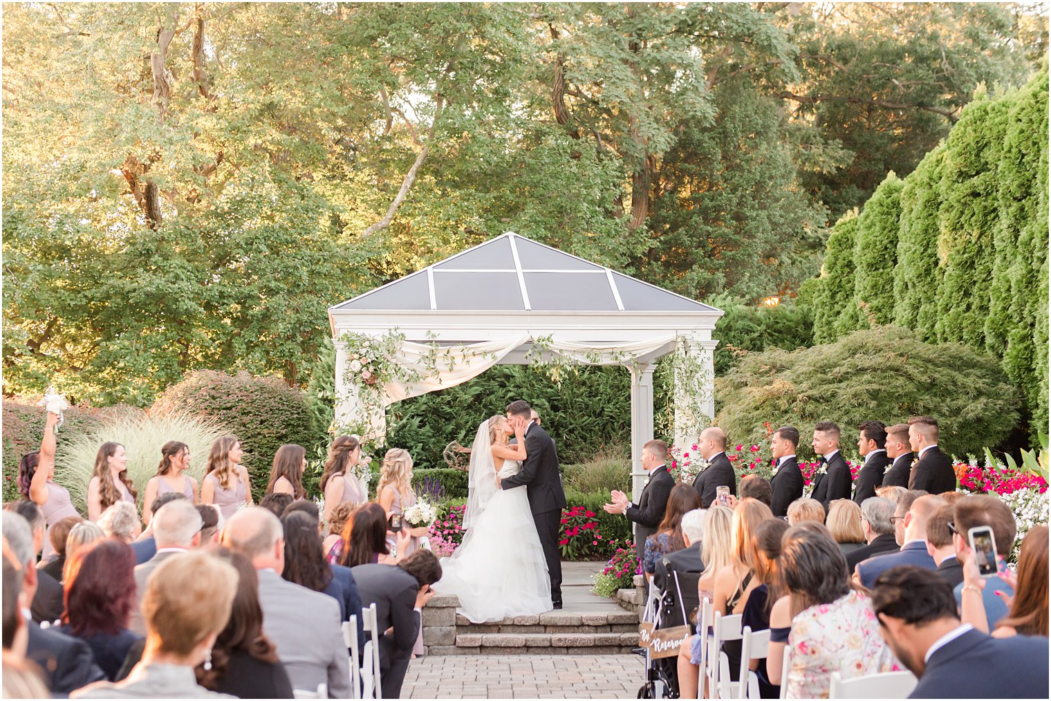 bride and groom kiss during NJ wedding ceremony