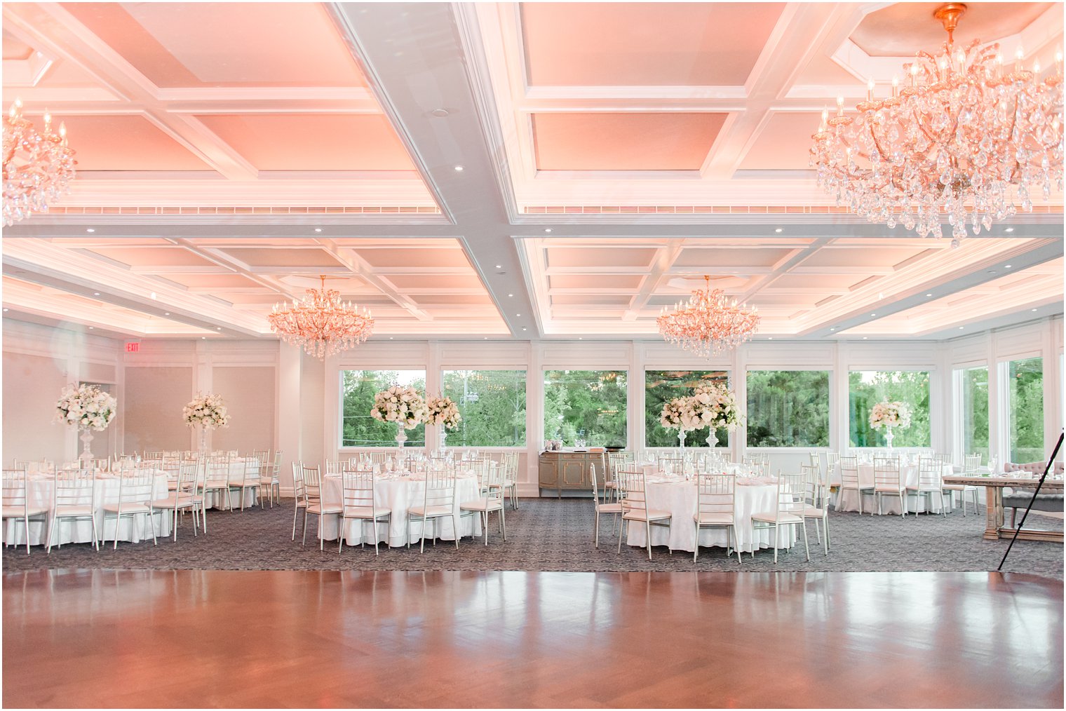 the Mill Lakeside Manor wedding reception with tall floral centerpieces