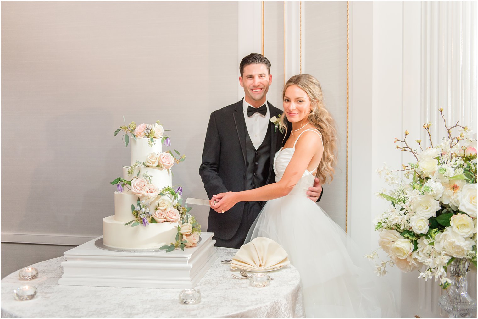 bride and groom cut wedding cake at Spring Lake NJ wedding