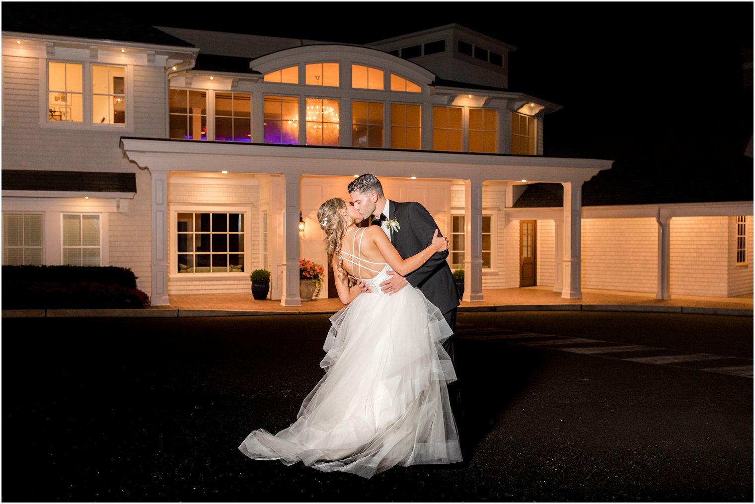 newlyweds kiss outside Spring Lake NJ venue