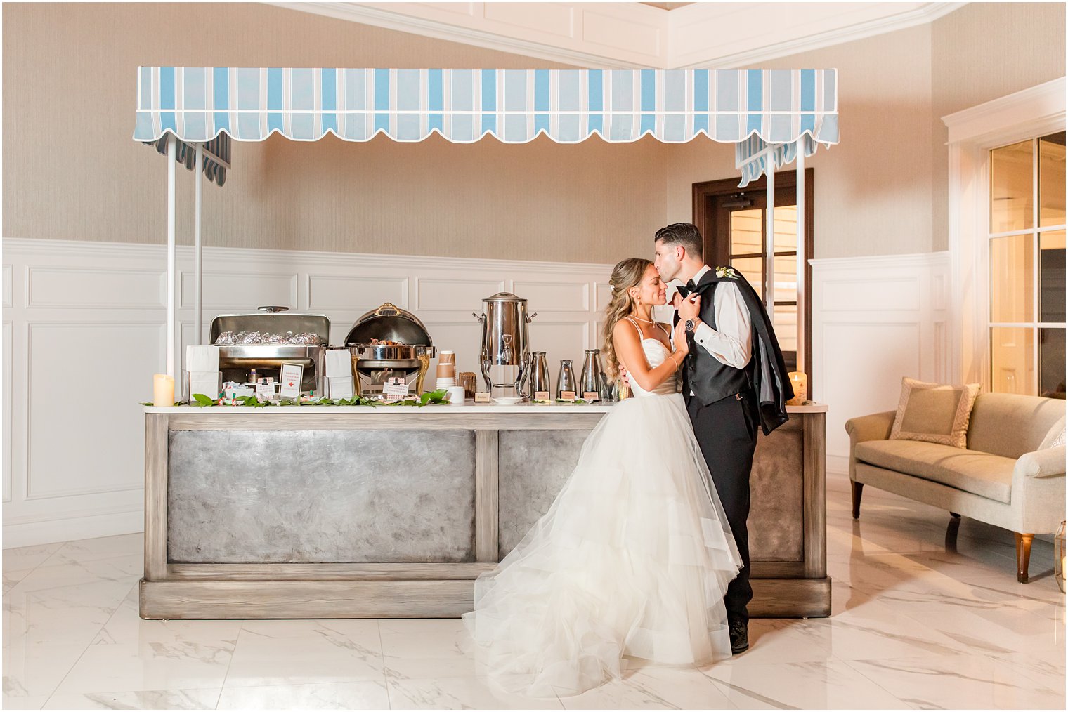 bride and groom pose by coffee cart at the Mill Lakeside Manor