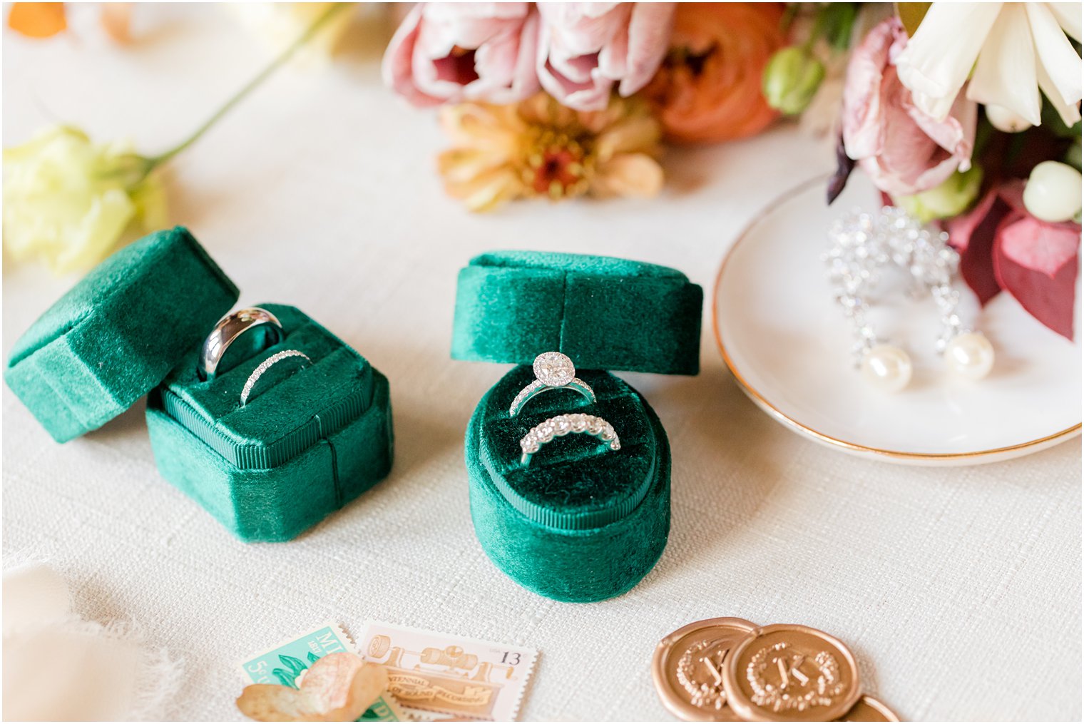 wedding bands rest in emerald green ring box