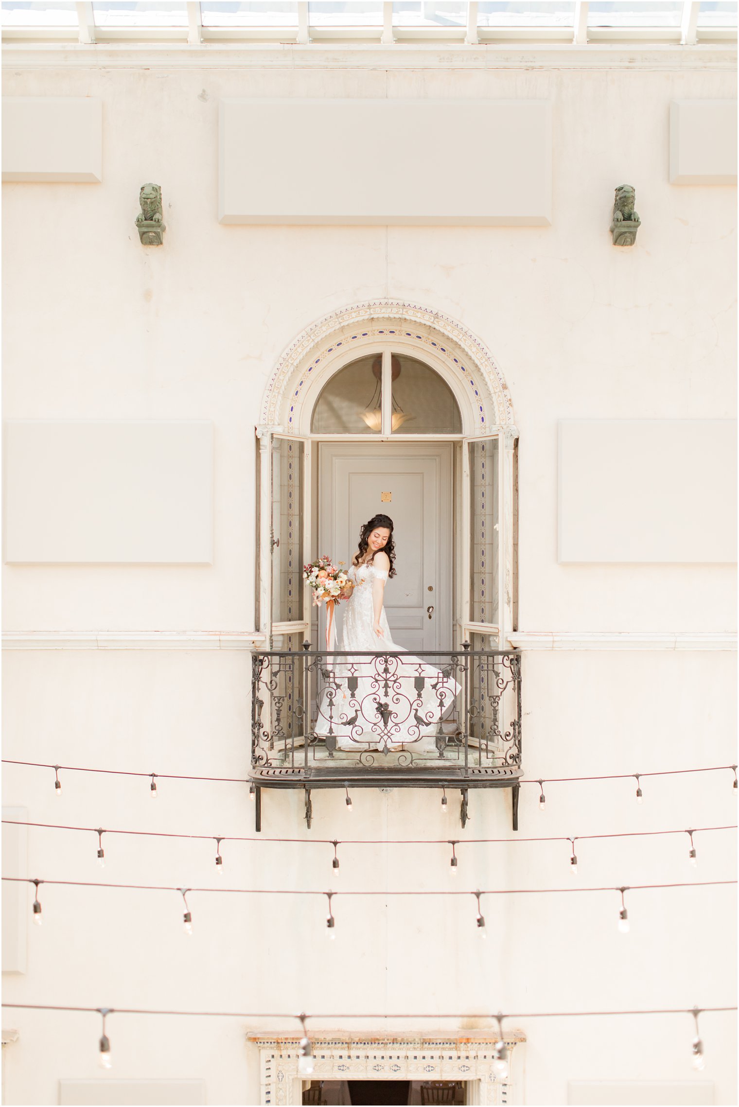bride looks over shoulder on balcony at Village Club of Sands Point