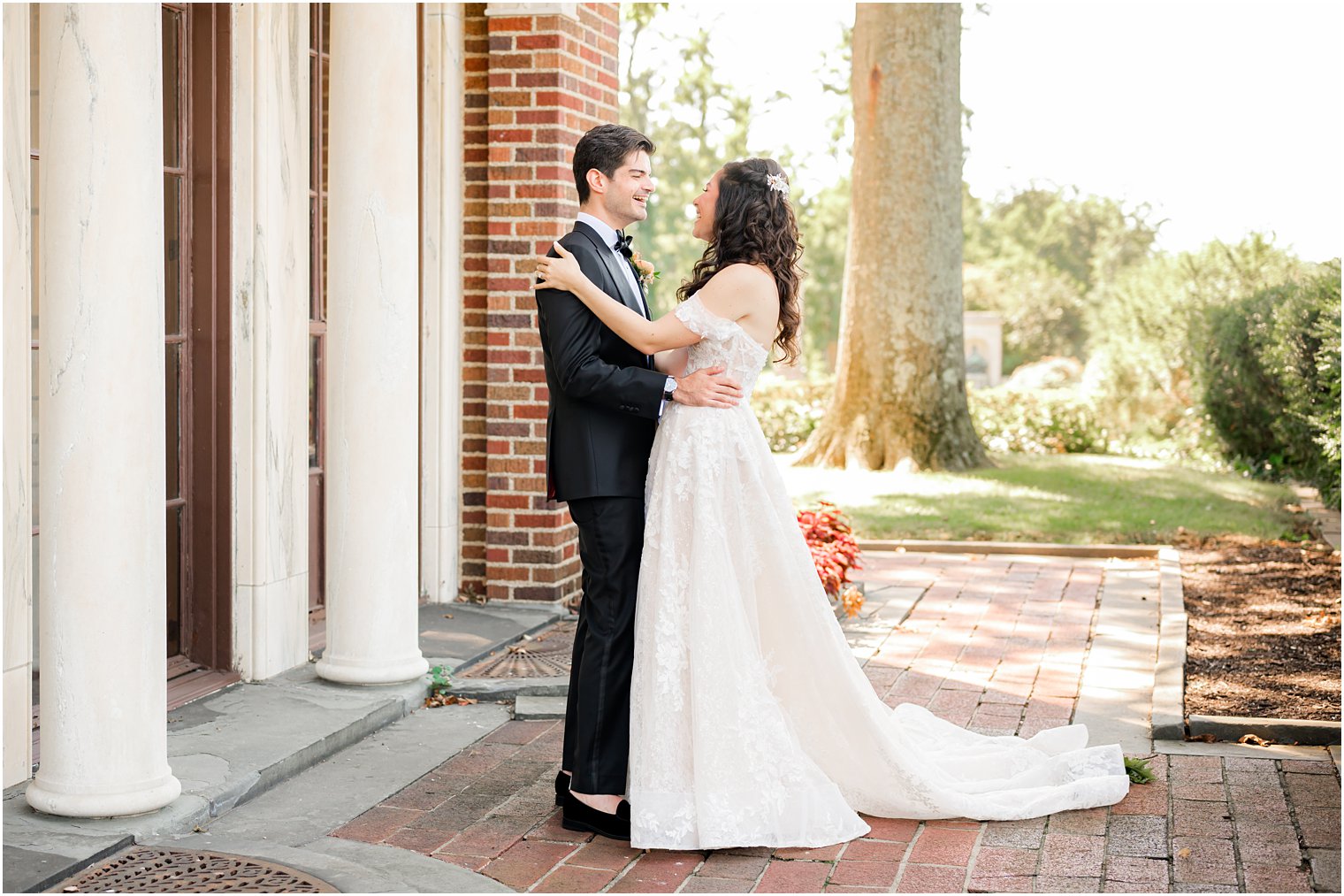 bride and groom hug during first look at the Village Club of Sands Point