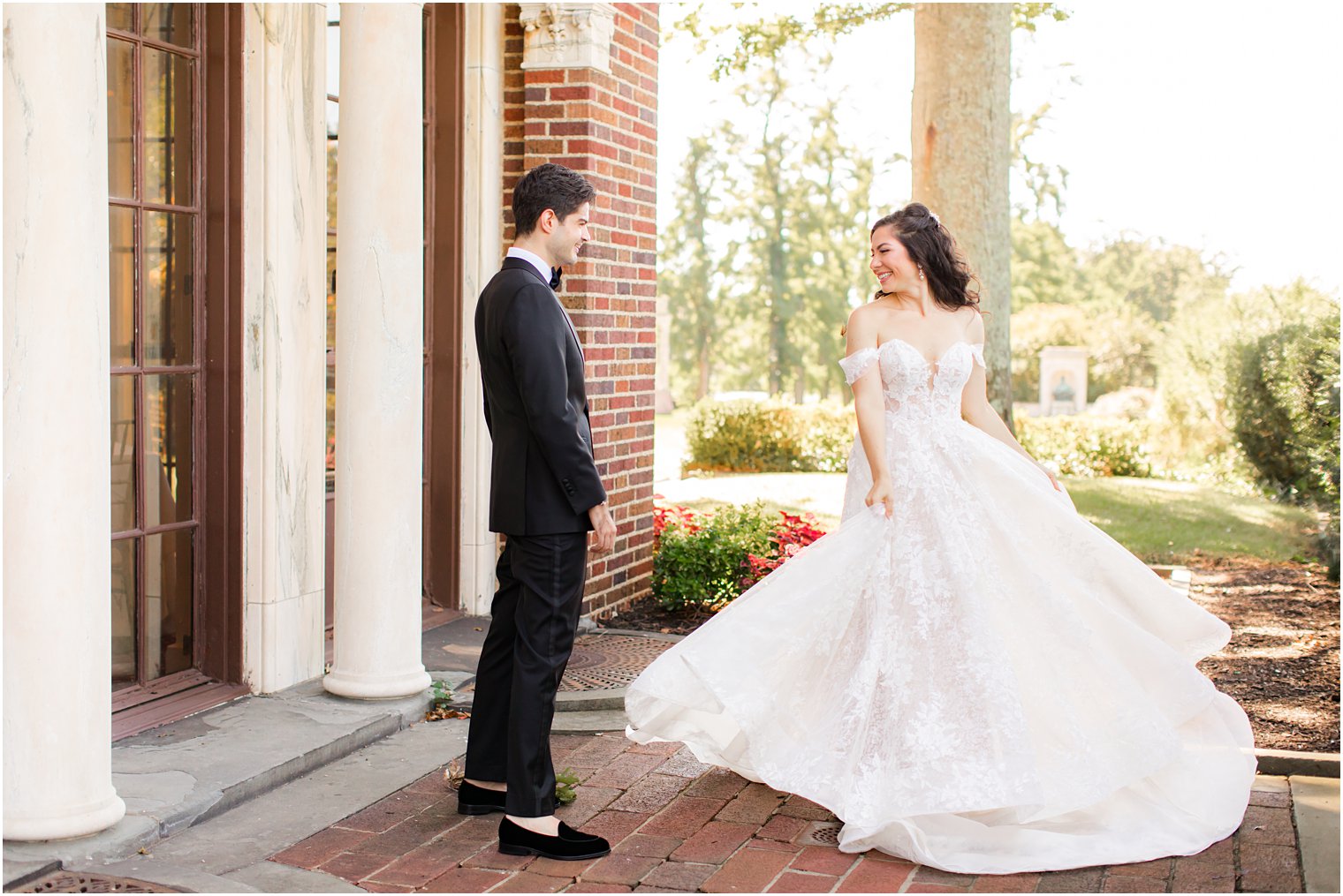 bride twirls showing groom wedding dress in New York