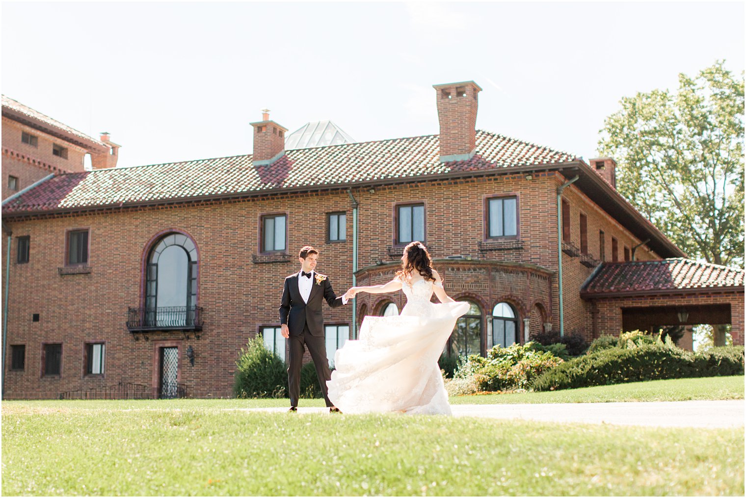 newlyweds walk outside the Village Club of Sands Point