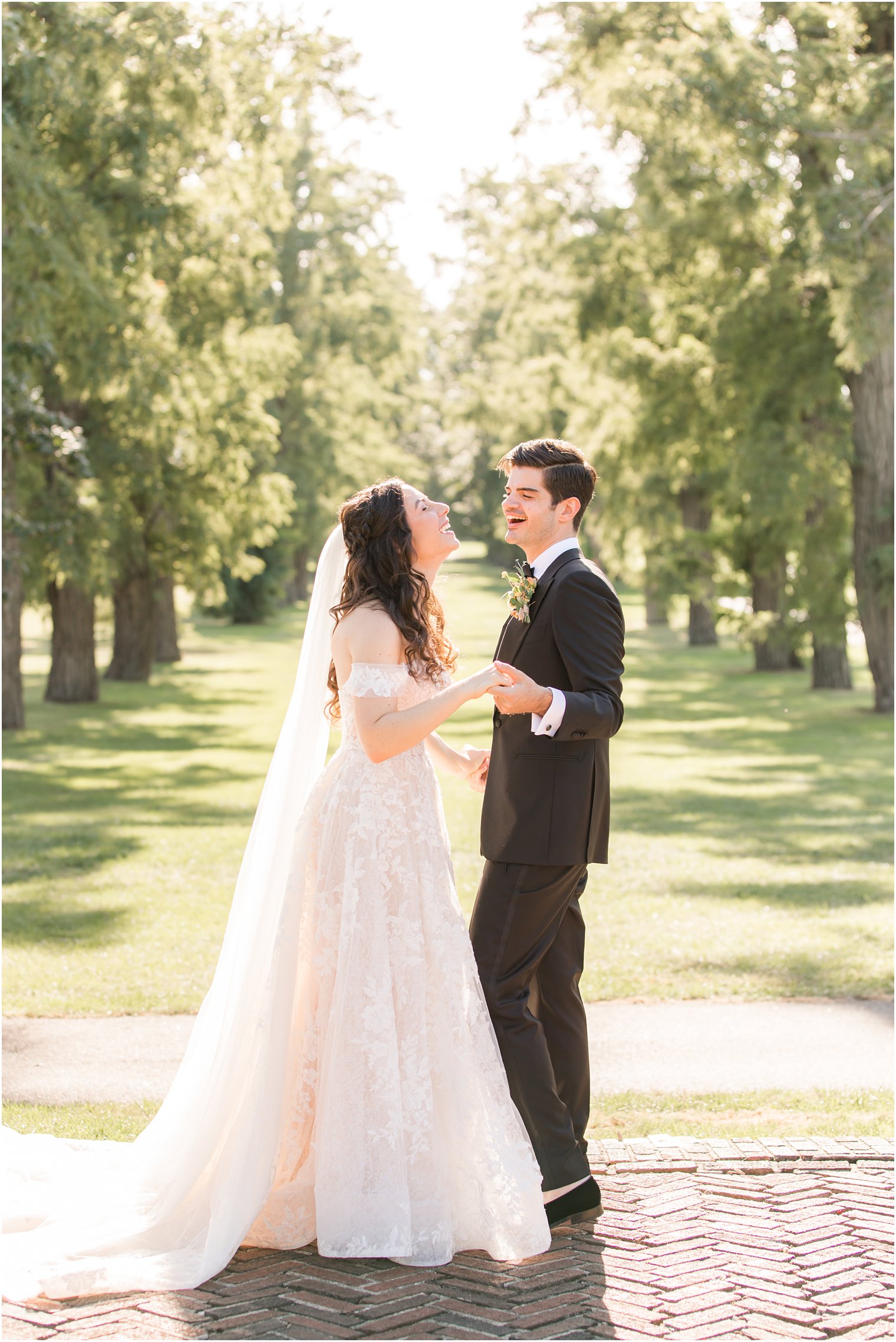 bride and groom laugh together at the Village Club of Sands Point