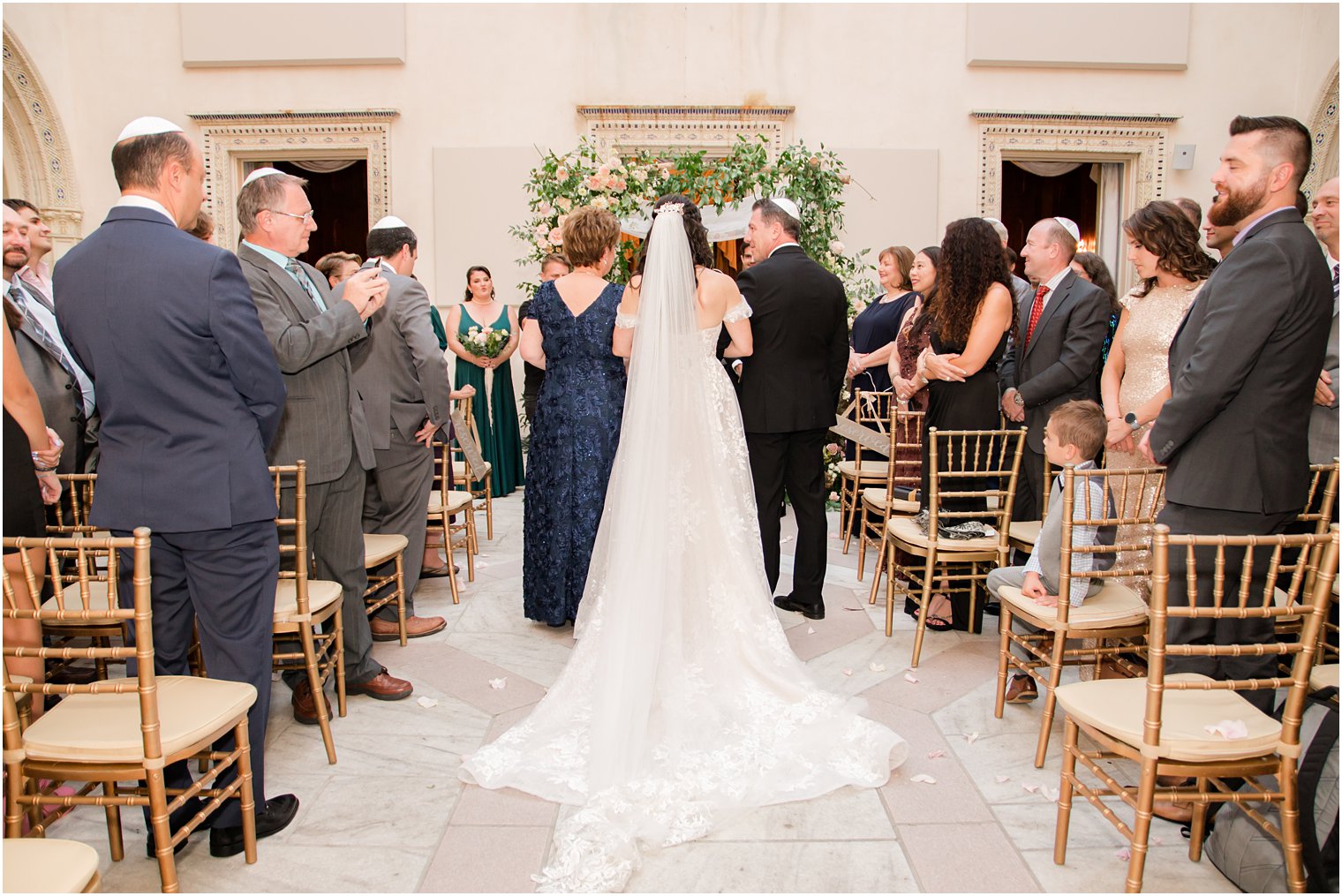 parents walk bride down aisle for Jewish wedding ceremony