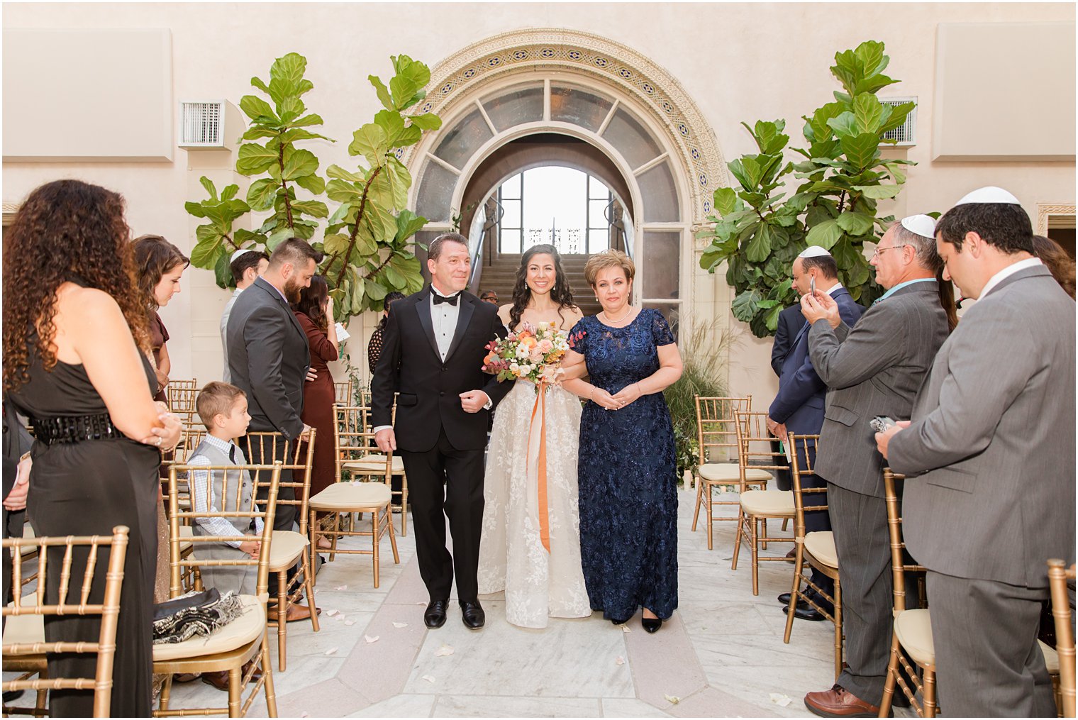 parents walk bride down the aisle at the Village Club of Sands Point