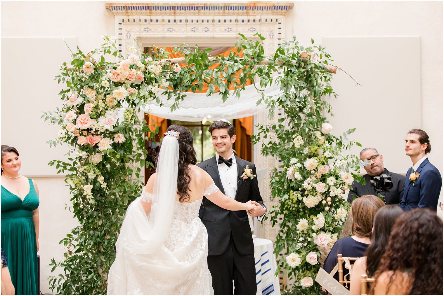 newlyweds dance by the chuppah