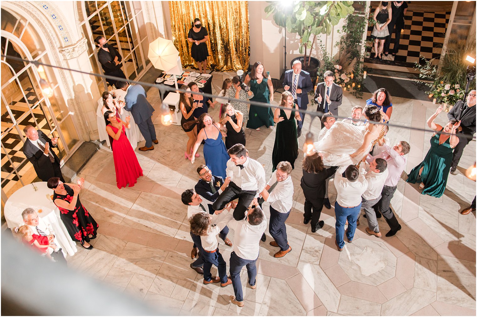 newlyweds dance hora with guests